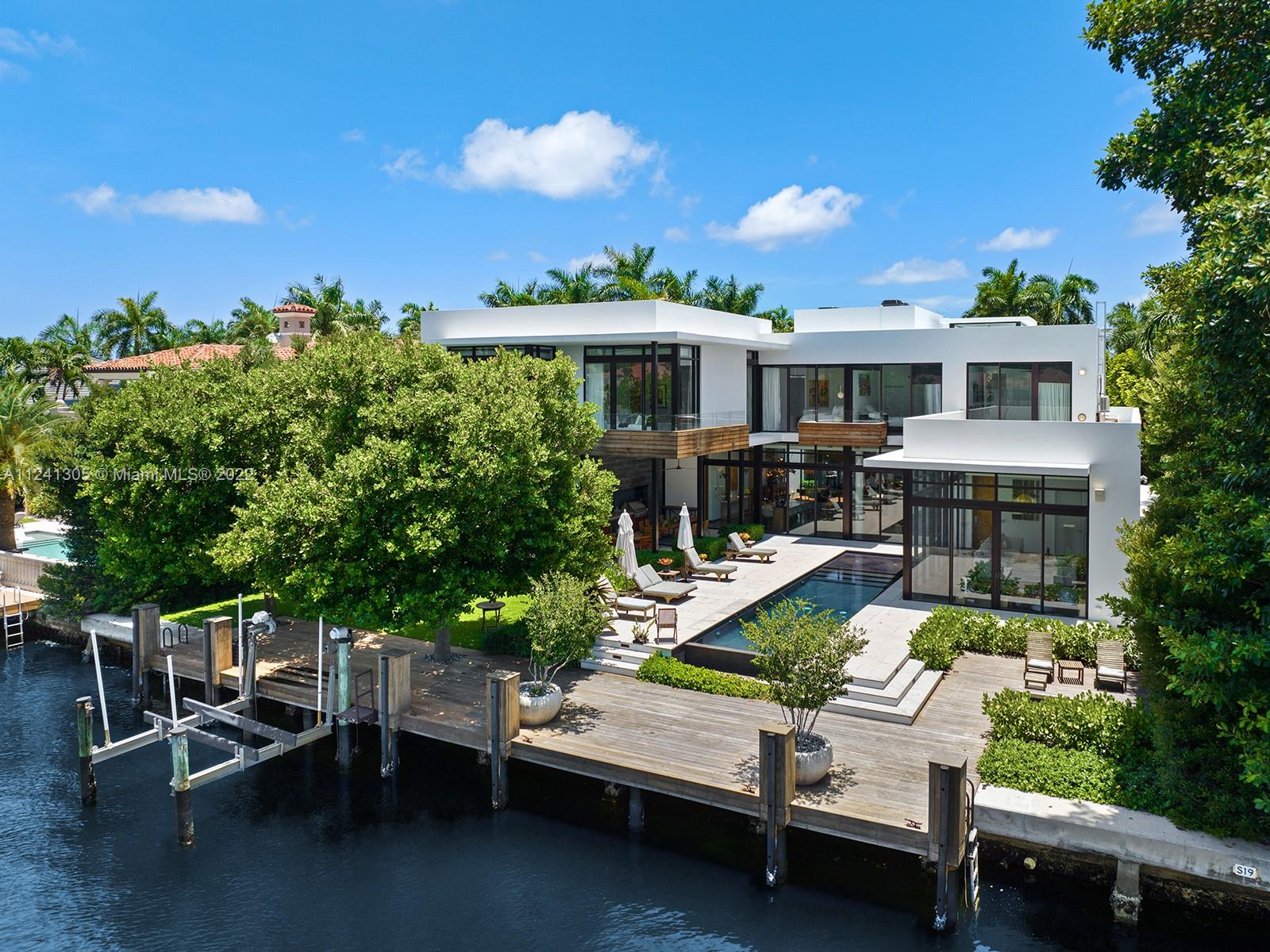 This contemporary 8,960 square foot residence is an impressive showplace on 100 linear feet of direct Intracoastal Waterway frontage within intimate Golden Beach, and a short distance from the town’s residents-only beach club. Organized around a central terrace and infinity pool, the home offers spectacular views and a refreshing feeling of openness throughout while ensuring privacy and safety. Expansive modernist interiors, including the home theater, chef’s kitchen, and lavish master suite, were given a refined minimalist aesthetic by Deborah Wecselman Design. Outside, lush subtropical landscaping creates delightful outdoor living spaces, including a secluded whirlpool deck, a waterfront lawn, and a dining terrace with a summer kitchen.