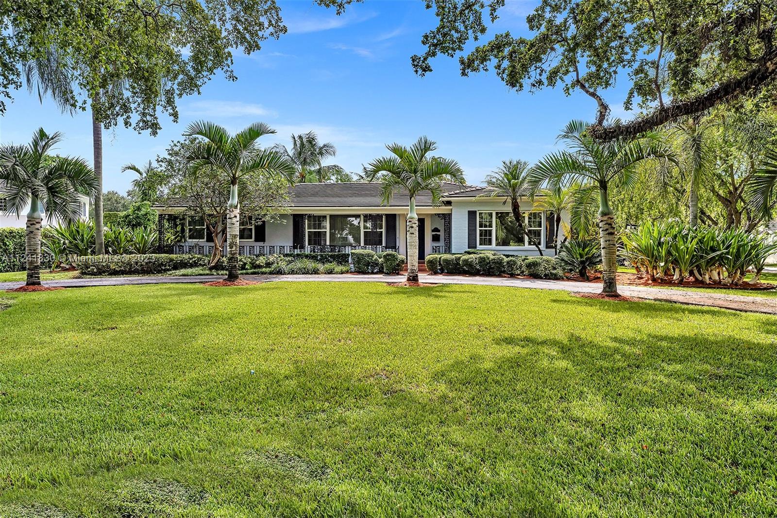 BROKERS OPEN WEDNESDAY 2/1 12pm-2:00pm. NEW PRICE. As Florida has continued to be the top destination for personal and business relocation, Coral Gables has cemented its place as the premier city for living & working in Miami. This exquisite single-family home is located on a large 16000+ Sq. Ft. corner lot. right on the beautiful tree-lined Alhambra Circle. It features 4 bedrooms, 3 bathrooms, remodeled kitchen with new appliances, florida room, family room and formal dining room, it showcases the detail of original hard wood floors throughout, cedar closets, impact windows, and plenty of storage. The living areas are spacious with a practical lay out, perfect for entertaining. Pool area and backyard with plenty of greenery. Two car garage and extra parking on the side of the house.