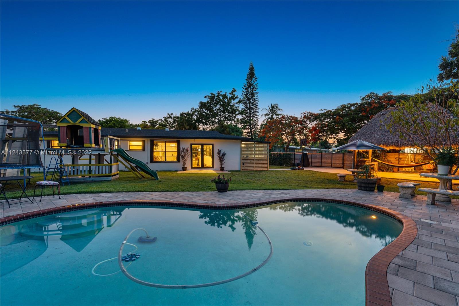 This AMAZING home has finally hit the market.  This beauty sits on a huge 14,139 sq ft lot making it a perfect home for entertaining and enjoying the outdoors.  Outdoor features include a refreshing 15X30 kidney shaped pool surrounded by a gorgeous concrete paver pool deck, 2 Tiki Huts and plenty of lounging areas. The property is fenced all around and there's plenty of space for a boat and RV.  Kitchen and bathrooms were remodeled in the last 5 years.  New roof installed in 2020 and A/C is only 6 months old.  Flooring is a mix of tasteful wood grain tile in the living areas and waterproof vinyl in the bedrooms.  This home is the perfect way to enjoy the sought after Cutler Bay lifestyle.  Showings are by appointment only.