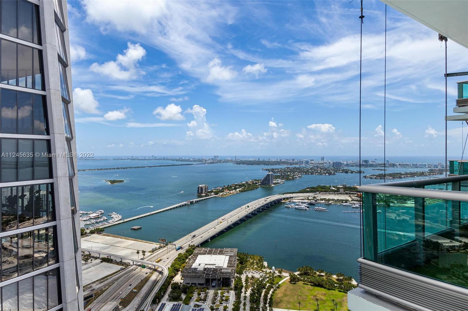 Live life at the top 63 Floors up! Rarely available top floor penthouse. Views from every bedroom; balconies in every room overlooking Biscayne Bay & the city skyline, perfect for sunsets/sunrises. 2,800+ interior sq ft. in Marble tile.  Ultimate privacy: Private Elevator w/ double door entrance & Feng Shui water fall to greet you. Stylish modern furniture/art compliment the expansive floor plan. Open kitchen/living area for entertaining, top of the line appliances. Large master with tons of closet space. Too much to list, this is a must visit property. Amazing gym complex with spa, multiple swimming pools, business center, party room. Minutes from seaport, airport, cruise terminal, South Beach, Financial District, Arts/Cultural centers. Live downtown & be part of Miami's future today!