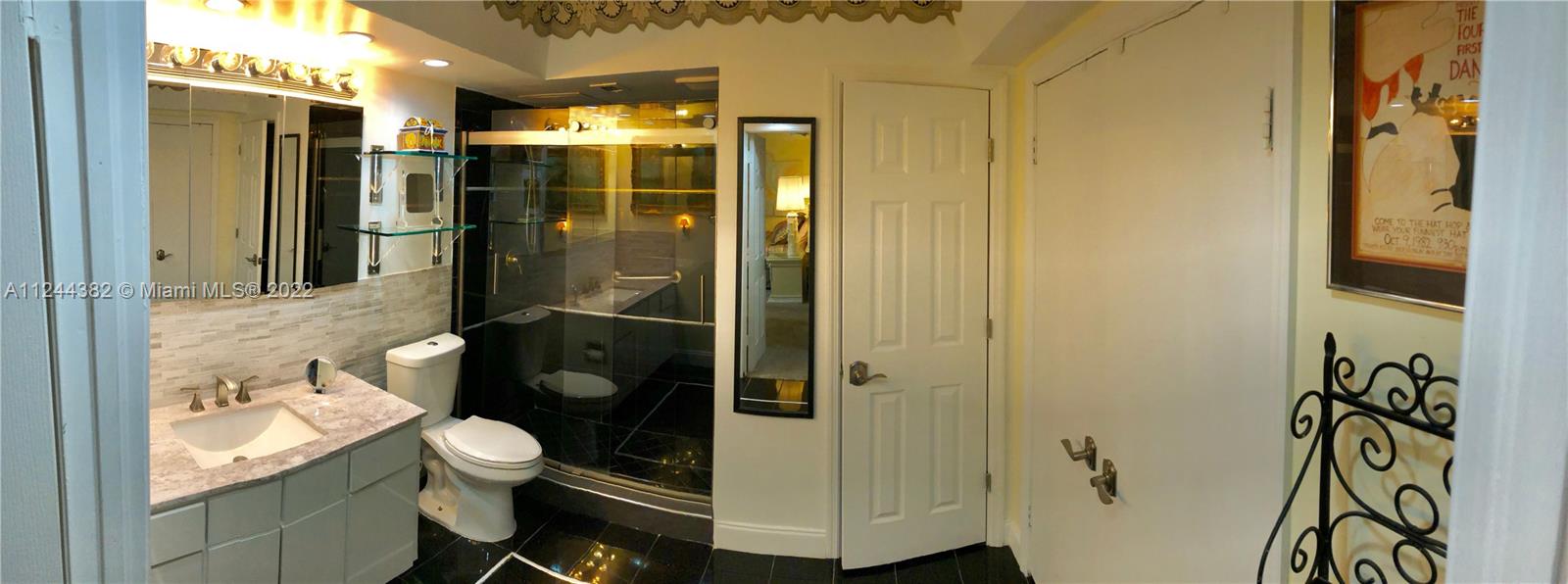 SPACIOUS PLUS+SIZED MASTER BEDROOM SPA STYLE BATHROOM WITH CUSTOM CLOSETS AND WALK-IN SHOWER