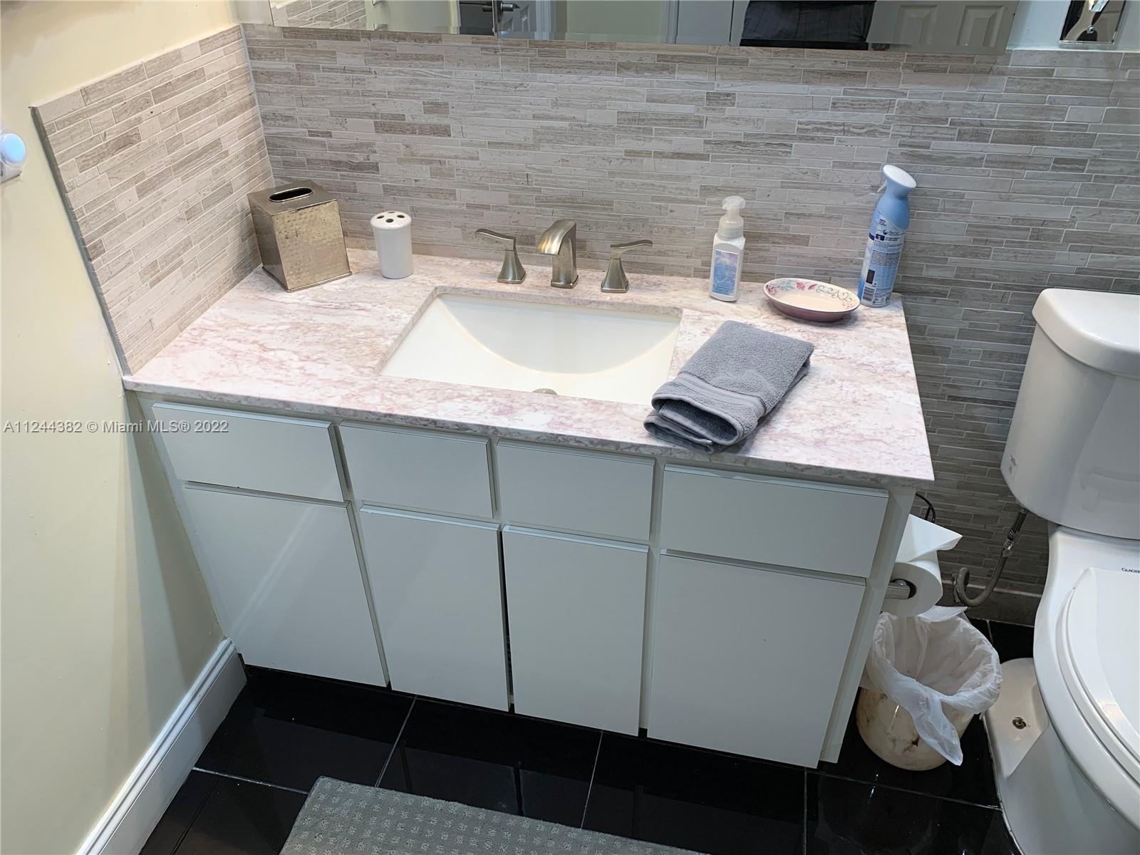 MASTER BEDROOM BATHROOM CABINET DETAIL WITH STONE MARBLE FINISHES