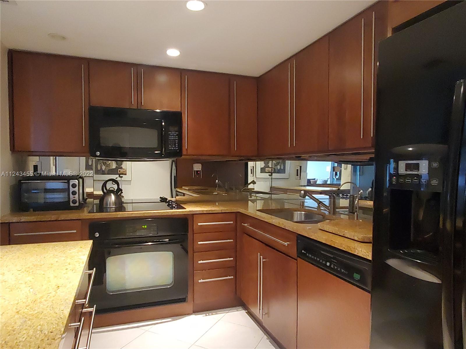 Offered furnished but will sell unfurnished, this 2 bed 2 bath 1312 sq. ft. unit overlooks the intercostal waterway. Amenities include a pool, hot tub, steam & sauna, and valet service. 1 in-building parking space & a storage room approx. 36x36x84.
With the maintenance, the 32-acre complex offers, cable/internet service, 24/7 security, state-of-the-art health spa/gym fitness center with professionally instructed classes, spinning, yoga, card playing rooms, 8 tennis & racket ball courts, basketball court, sauna and steam rooms, lap pool, children's playground, pet friendly with a spacious doggie park, and boat dock available. Miami Shores Country Golf Club (18-holes) within a 1/4 mile. 20-40 minutes from the Miami or Fort Lauderdale airports and Miami’s renowned South Beach community.