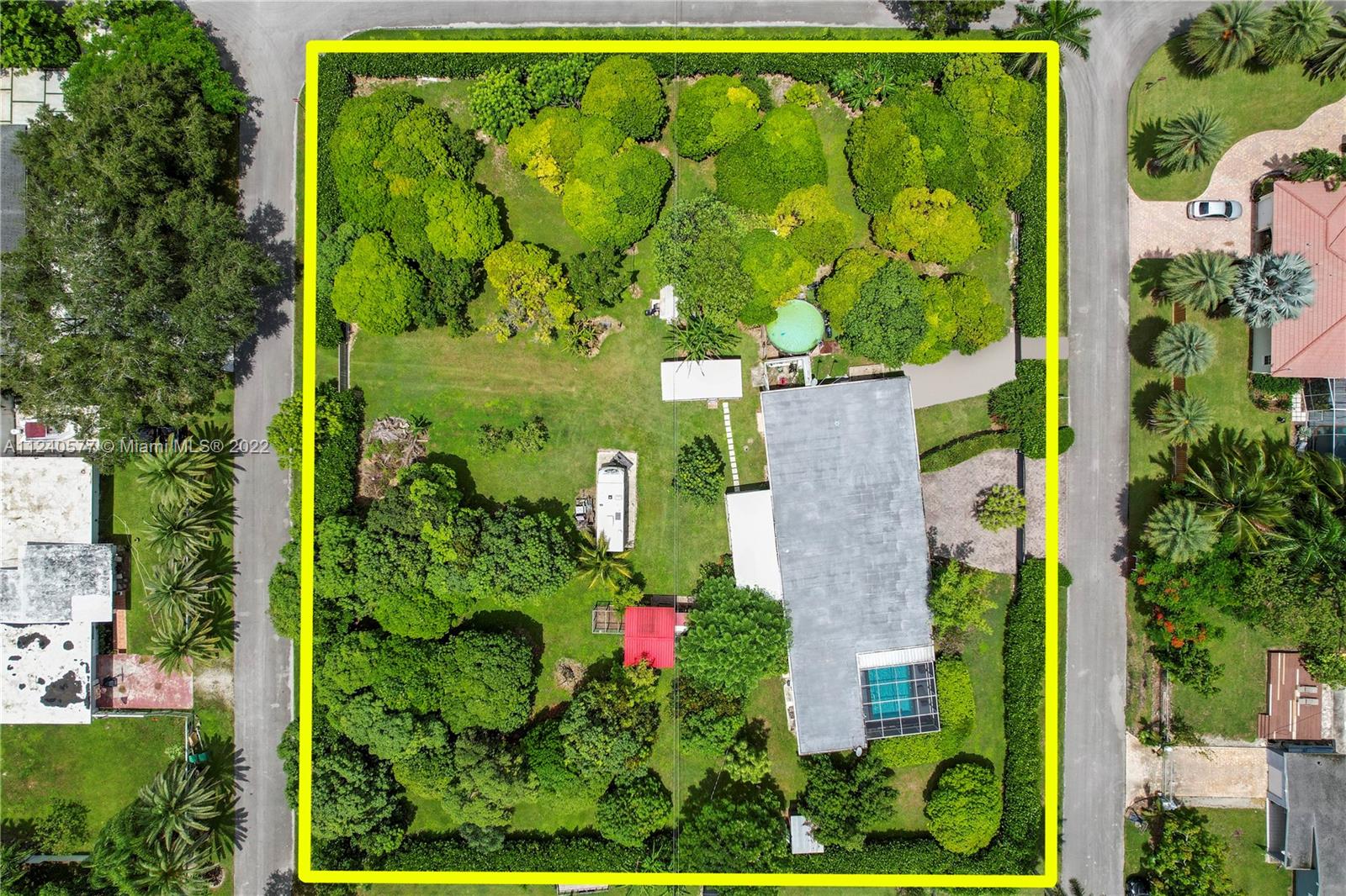 REDLAND 1.27 ACRE RENOVATED 3012 SF POOL HOME W/ ATTACHED GUEST QTRS, POLE BARN, & ASSORTED FRUIT TREES. THE PROPERTY SITS BLOCK TO BLOCK W/ A REAR ENTRANCE. BOTH MAIN HOUSE & GUEST QTR ARE ATTACHED & HAVE A NEW ROOF, IMPACT WINDOWS & DOORS. THE MID CENTURY MODERN VIBE MAIN HOME FEATURES NEW FLOORS & CUSTOM LIGHTING, A CHEFS DREAM KITCHEN W/ CUSTOM CABINETS, COMMERCIAL SIZE REFRIG/FREEZER, QUARTZ CTR TOPS, OPENING TO THE LIV. AREA OVERLOOKING THE POOL. THE MAIN SUITE IS OPEN & BRIGHT INCL FRENCH DOORS OPENING TO BACK PATIO W/ A HUGE MAIN BATH. THERE IS A JUNIOR SUITE WITH FRENCH DOORS TO POOL. THE GUEST QTR'S IS A 2/1 WITH LIVING AREA & KITCHEN WITH A SEP. ENTRANCE & GATE. ASST TREES: STAR FRUIT, LYCHEE, MANGO'S, BANANAS, & AVOCADOS. PART OF FOLIO CAN BE DIVIDED INTO 15,000 SQ.FT. LOT.