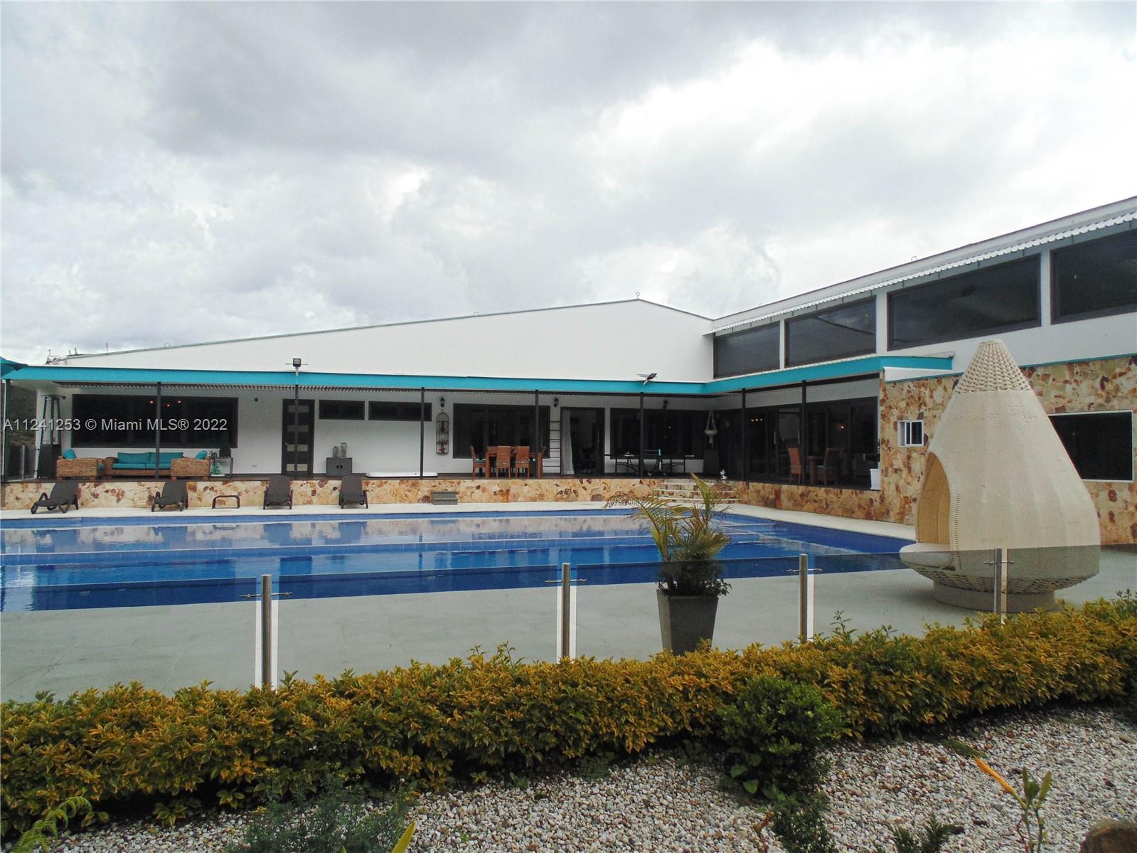 side view form pool and back side of the main house