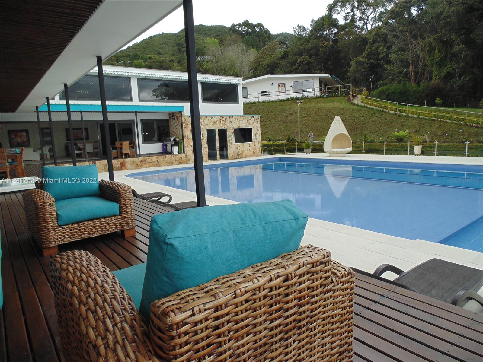 Porch view L shape around the main house and Pool