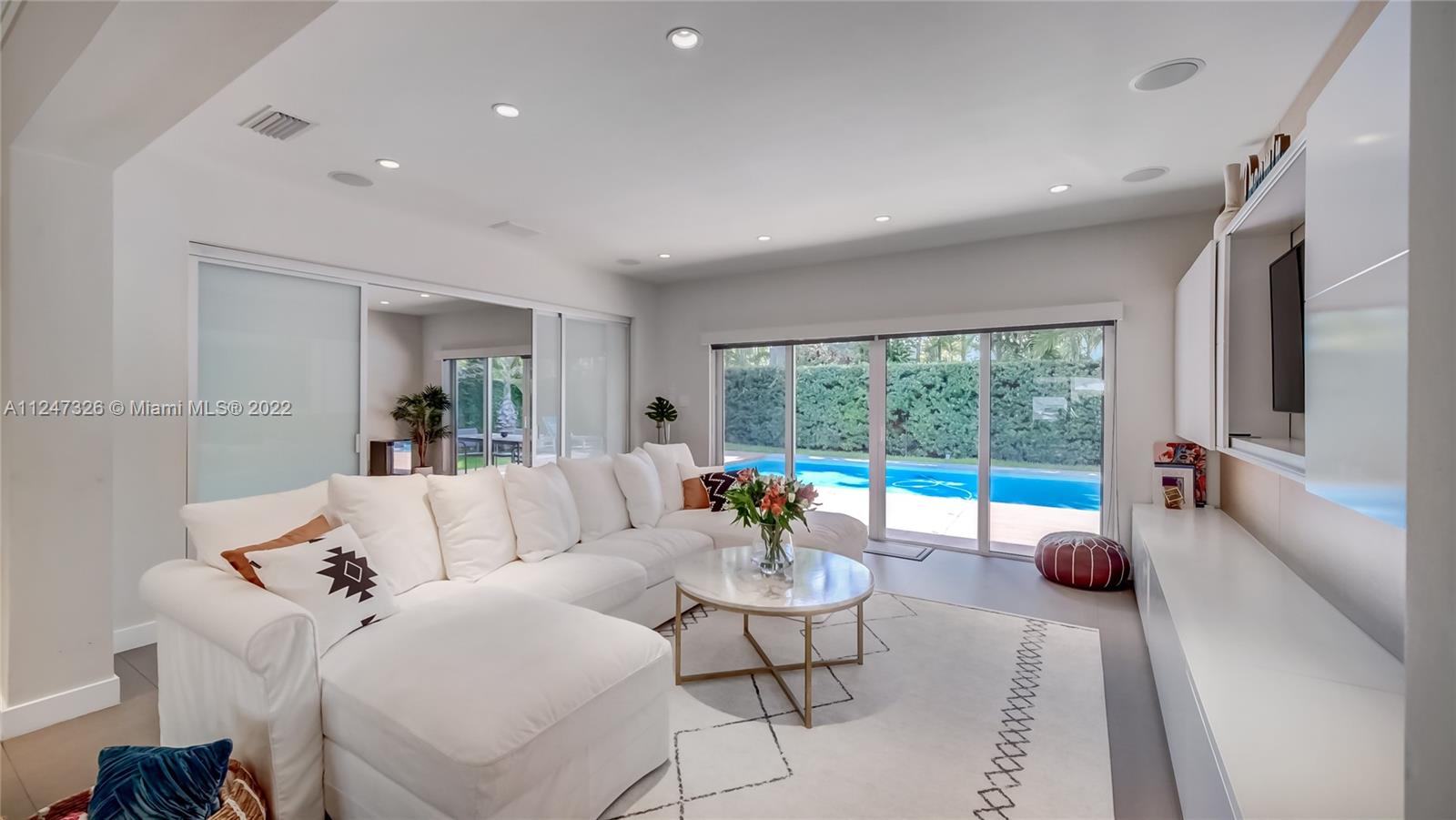 Impeccable recently Renovated furnished 3 bed 3 bath home in North Coconut Grove inside Bay Heights community.
Incredible location with a great floor plan and flexible spaces. Gorgeous gray ceramic floors throughout the living area and hardwood floors in the bedrooms, stainless steel appliances, office and living room open to a modern deck and heated (solar panels) swimming pool area. Garage with plenty of storage and gym equipments, gas generator, Mosquito Nix system, and additional storage room with half bath. This superb community offers a police patrol 24/7 without any mandatory association dues as well as not in a flood zone. Family friendly neighborhood perfect for walking or kids riding bikes. Live only minutes away from downtown Brickell, Miami Beach and Key Biscayne.