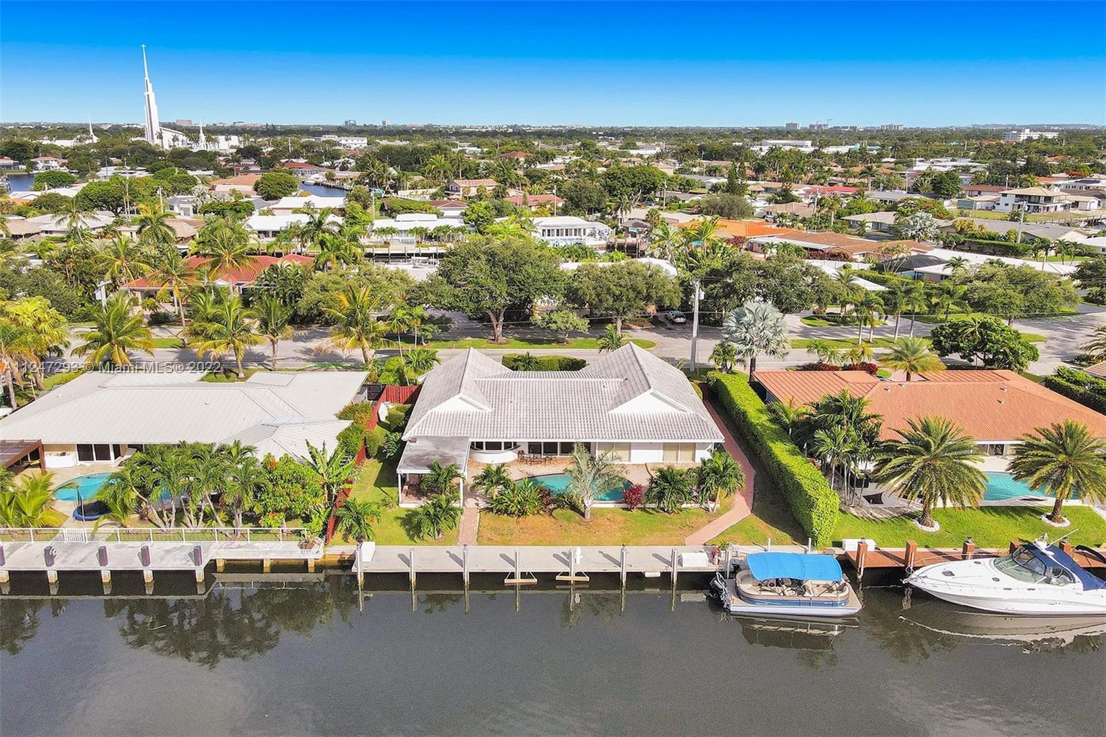This impressive waterfront home sits on 100ft of deep water with NO FIXED bridges to the open ocean. Located in the prestigious "Landings" one of Ft Lauderdale's sought-after communities.Minutes to the beach,shopping & some of the finest restaurants.This open floor plan has a large master bedroom & bath, 2 additional bedrooms plus a den/office. A remarkable large open kitchen for entertaining family or guests. Every room has wonderful natural light.Separate Laundry room w/2 car garage. Outside you have a large patio for cookouts, lounging or taking a swim in the heated pool that overlooks a wide Intracoastal canal.  Bring your YACHT and tie up to this beautiful concrete dock that accompanies 100 AMP shore power. This home is a boater's dream & the true lifestyle of living in South Florida.