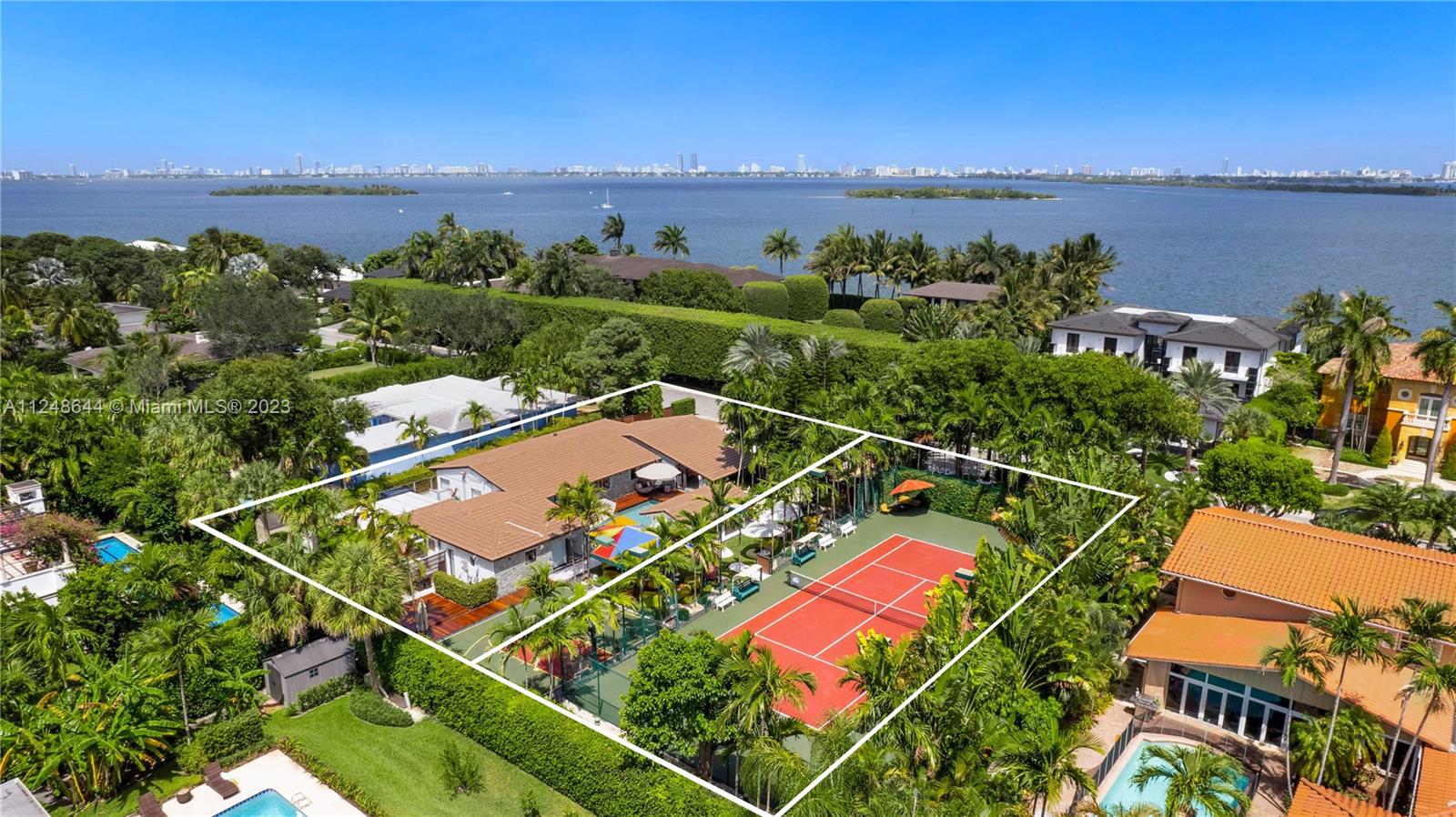 TWO LOTS! Unique opportunity to own two contiguous lot perfect to build two homes in the most premium location in the island of Bay Point.  CASA CLUB. Enjoy this tropical paradise perfect to live and entertain at the exclusive island of Bay Point, the only true gated private community in the east of Miami with the most amazing outdoor living with your private Tennis court, basketball court, mini golf, billiard room, and gym in this charming double lot, fully renovated, 5 bedroom, 4 bathroom, modern ranch home. All new: roof, impact windows, modern kitchen with stainless steel appliances.  Guest quarter with morning bar and gym. Just 10 min from Miami Beach and MIA. Next to Design District, Midtown, Wynwood.