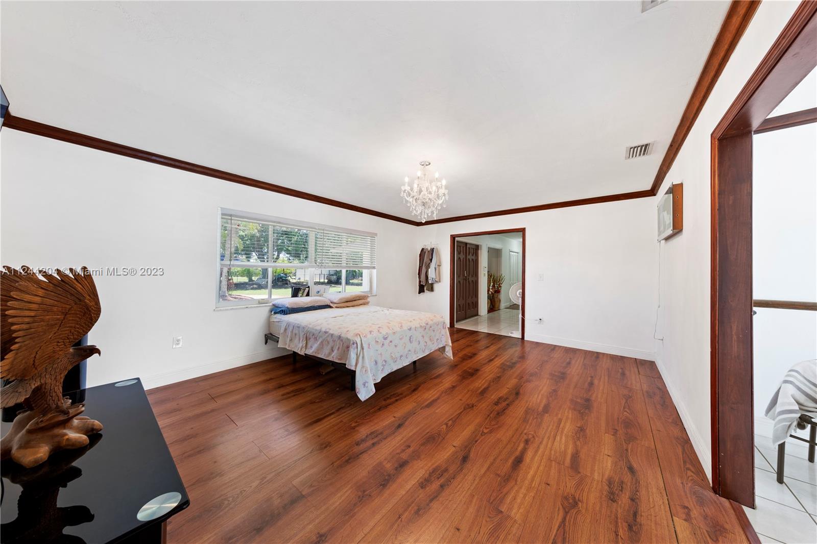 LIVING ROOM OPENS TO FOYER AND DINING ROOM