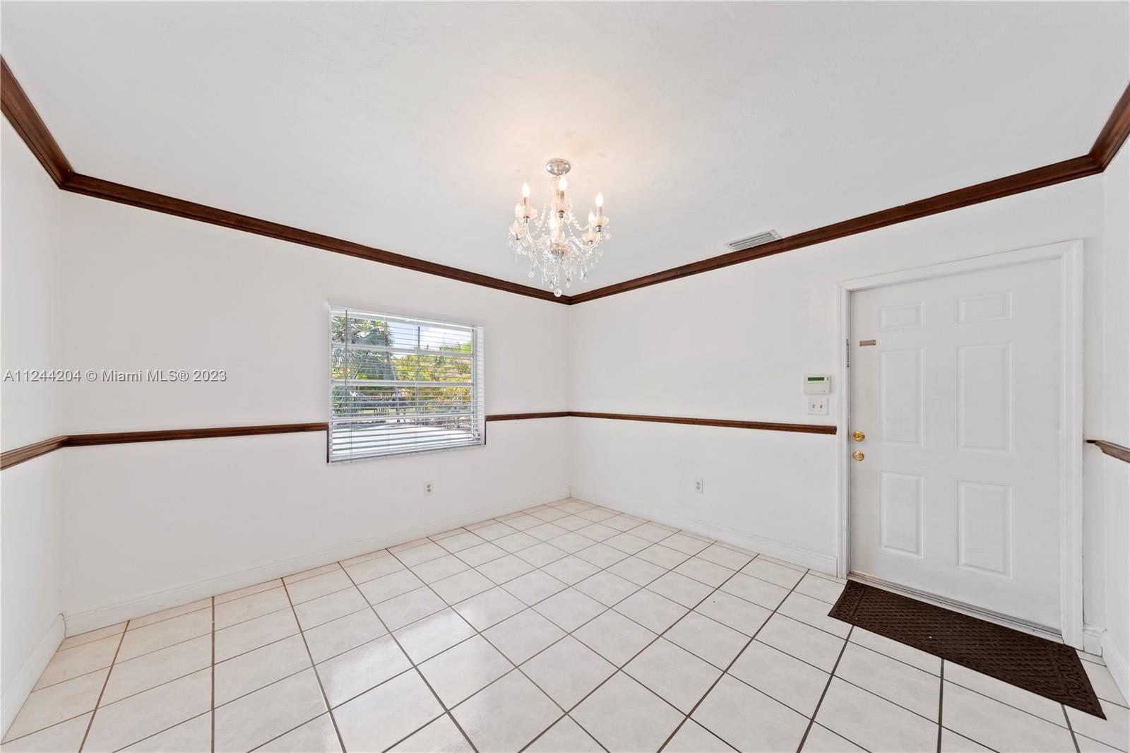 DINING ROOM OPENS TO KTICHEN AND OVERLOOKS POOL/PATIO