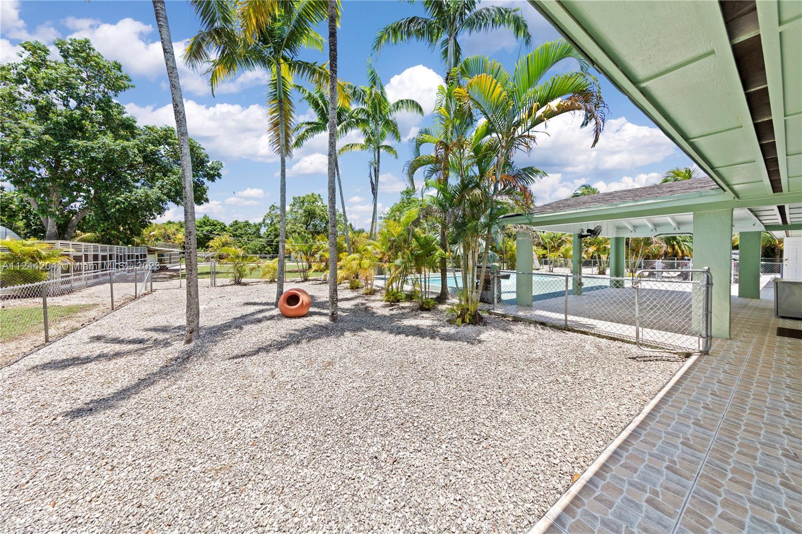 LOW MAINTENANCE WITH WALKWAYS AROUND THE HOUSE. THIS WALKWAY  LEADS TO CABANA BATH