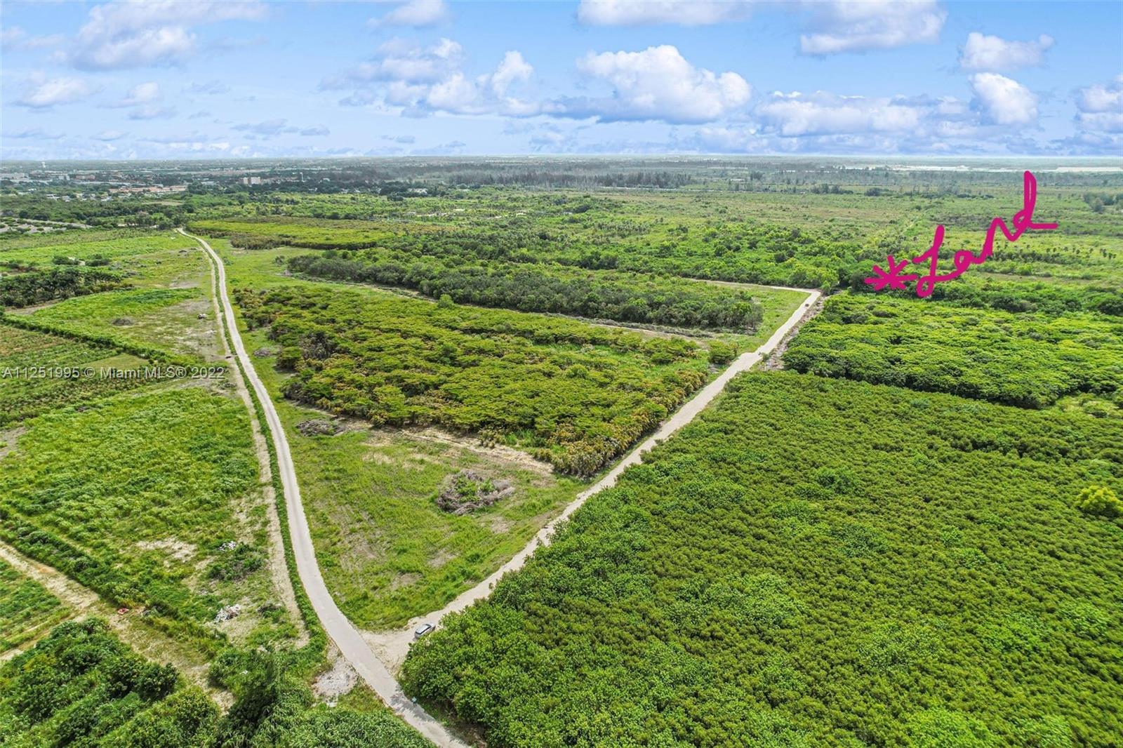 land marked in pink-property was only accessible through 4x4 prior to this gravel road - when you make the first left turn to follow this - you will see blue water markers from City