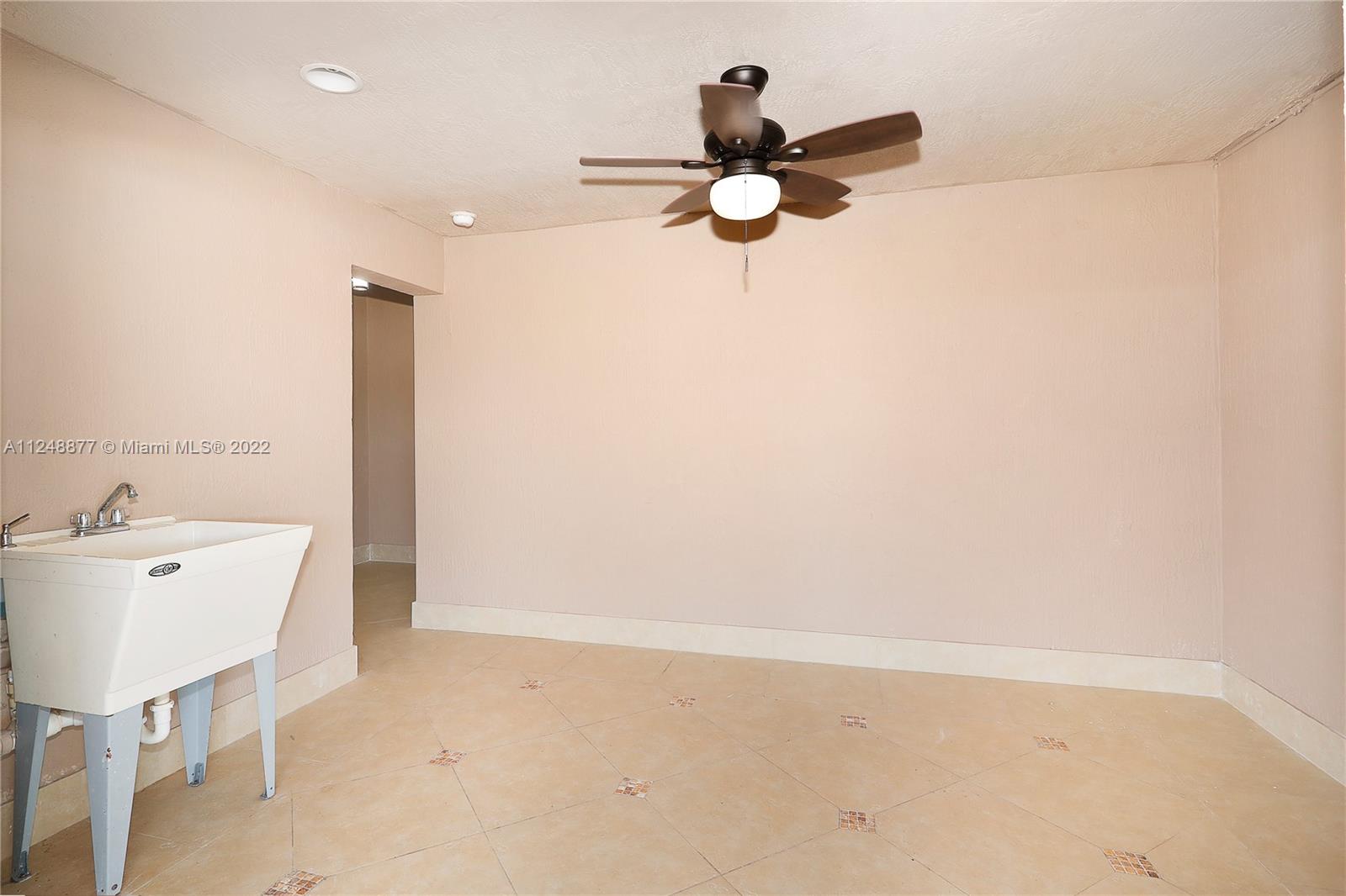 Utility room with impact French doors.