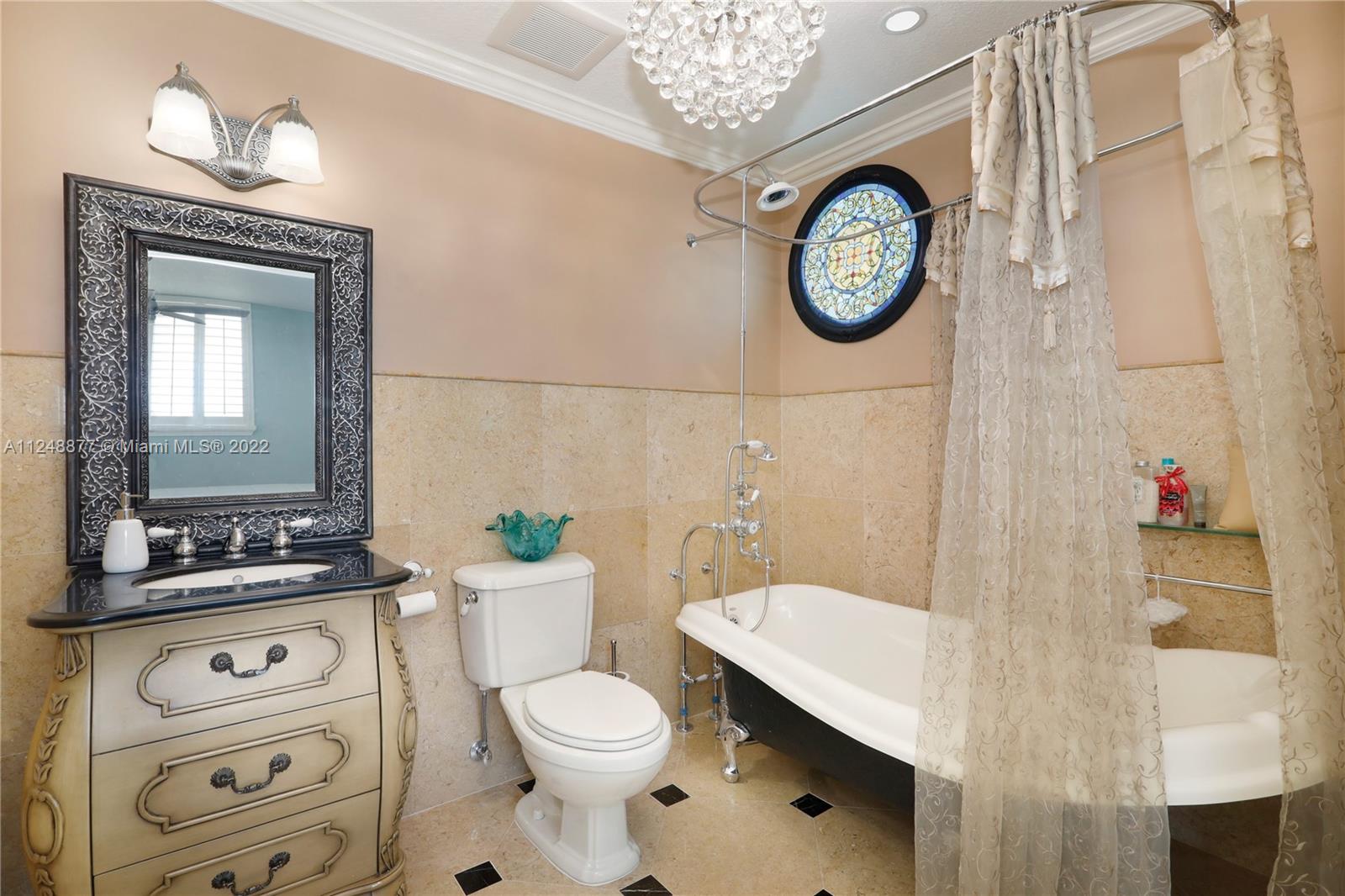 Master Bathroom with antique tub/shower.