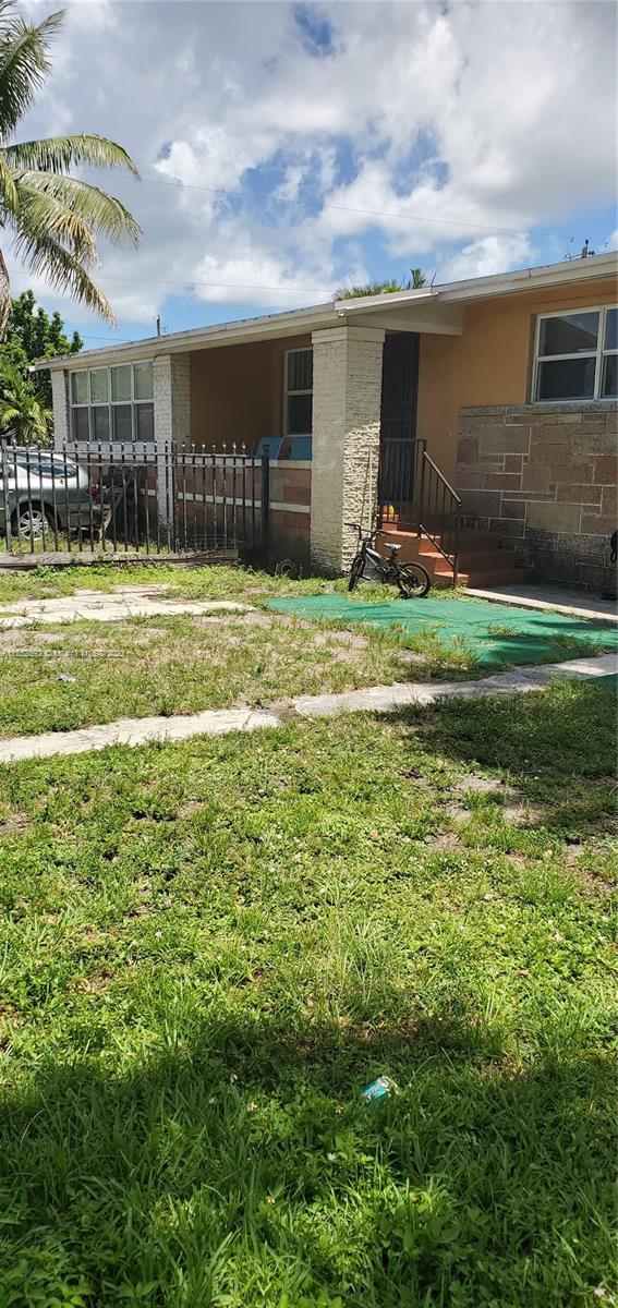 Fence separates front yard space for units