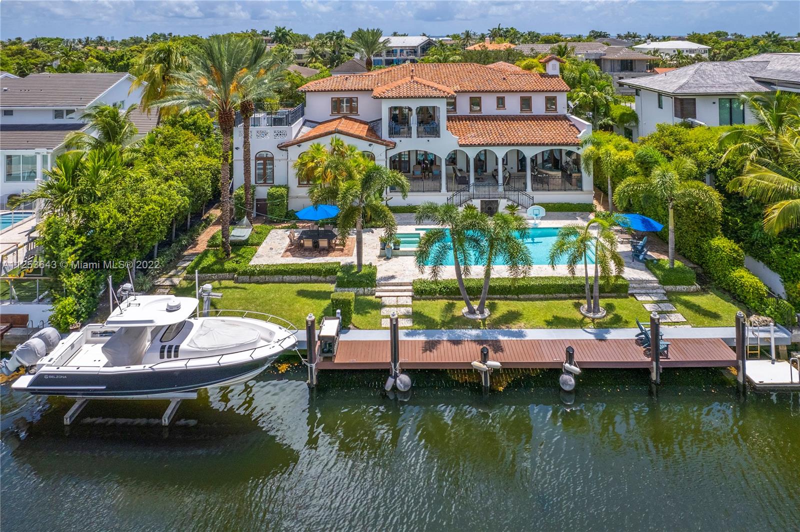 Stunning 2008 built home w/ beautiful details & great water access w/ 100’ on the water & no bridges to Bay in guard gated community of Sunrise. Convenient to Coconut Grove, but ideally situated in Coral Gables this home offers  wonderful outdoor spaces including 14,000 sf lot, pool & Jacuzzi, deep covered patio w/ summer kit, 25 ton boat lift, keystone patio & storage below patio. Indoors is as ideal w/ 6br/5.5 ba, office w/ built in fireplace, custom wine cooler w/ tasting rm, white/bright kitchen w/ top of the line appliances, breakfast nook surrounded by windows, butler’s pantry w/ wine cooler, primary suite w/ private balcony, beautiful bathrm w/ separate tub & shower, dual vanities, large closets, renovated baths, laundry rm, 2 car gar w/ room for lift, full house generator.