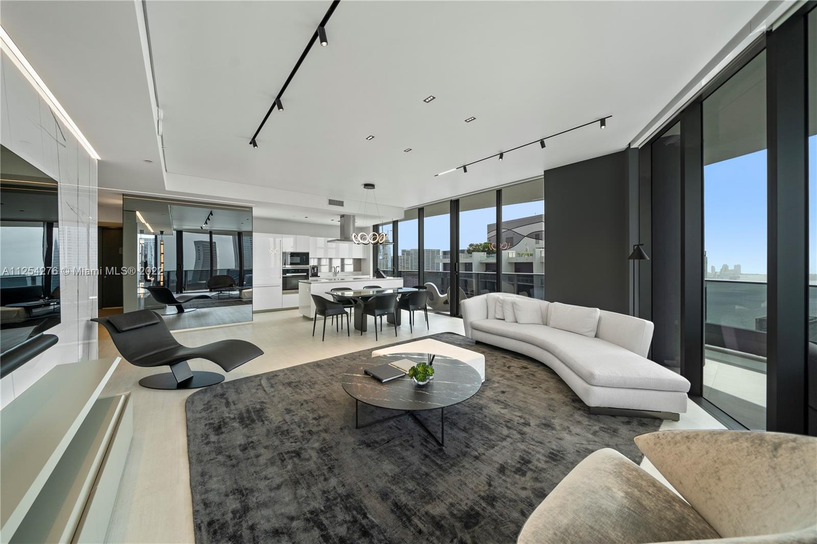 Amazing Penthouse level unit at Flat Iron @ Brickell. Professional decorated by awarded architect (fully furnished). 3 bedrooms, 3.5 bathrooms, den was converted to a walk in closet for master bedroom.
