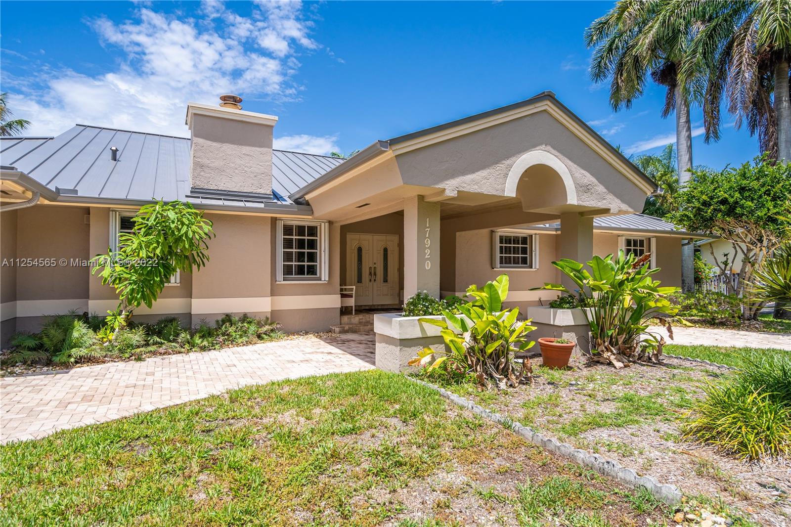 This Family home is situated on a large lot (14,994 Sq.Ft.) surrounded by natural foliage and fruit trees. Located in one of the sought-after areas of Palmetto Bay. This spacious 4br/3bath house was built in 1988 home features high impact widows, metal roof which was installed in 2021, 2 central a/c new, stainless steel appliances, taverntine pool deck, new compositedeck and the outdoor swimming pool with a screened-in enclosure make this the perfect home for a growing family. Come home today! Won't last long.near Coral Reef Public Park, a 2-minute ride to Coral Reef Elementary Schools as well as a walking distance to A+ rated Southwood Middle School. The quality of Schools and superb location is unmatched.