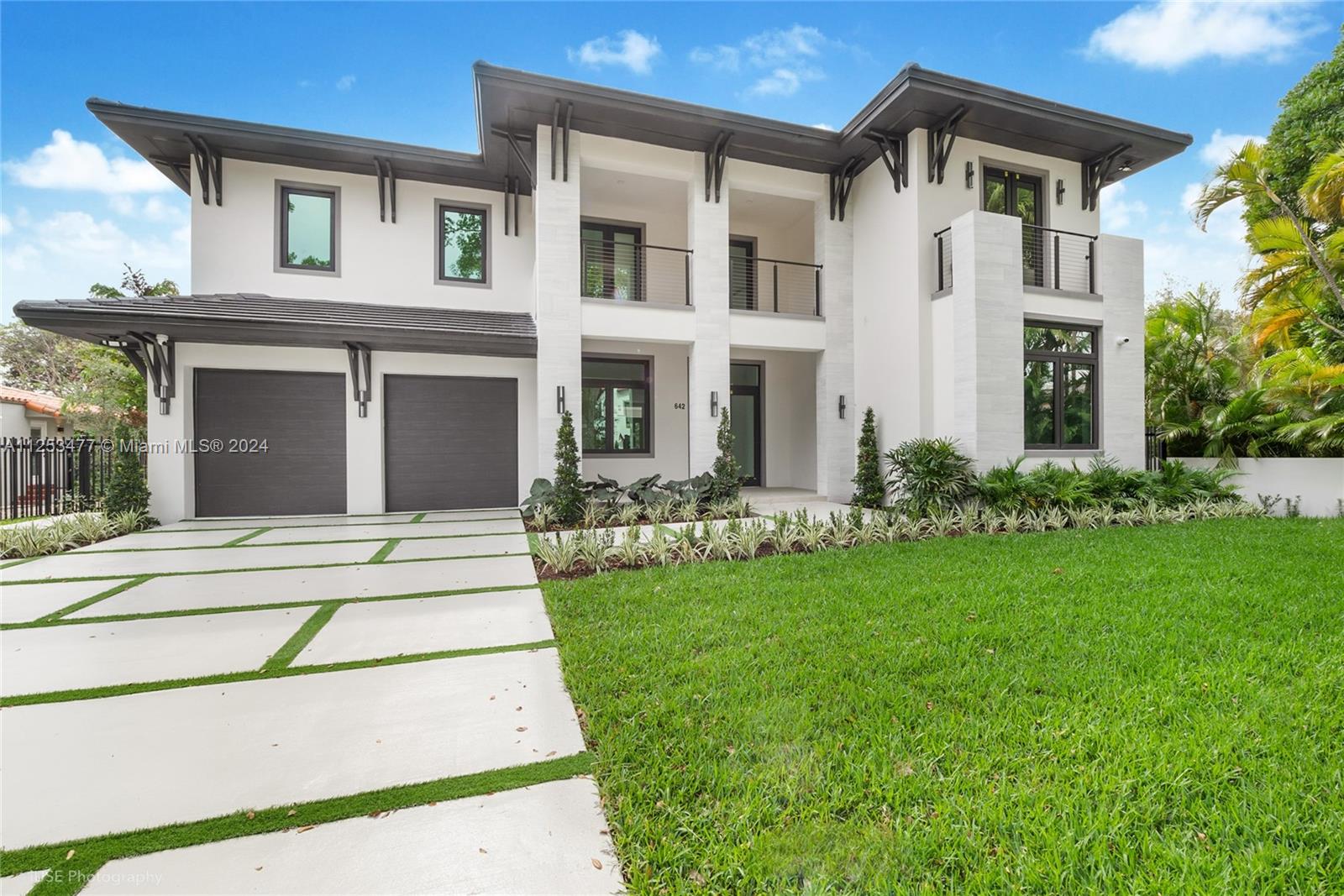 Brand new transitional-style executive home within walking distance from Granada Golf Course, Miracle Mile and Downtown Coral Gables. House is on a double lot and features 5 bedrooms, including one on the ground floor, 6 bathrooms, 2 car garage, ample yard and pool. Oversized main walk-in and jacuzzi. Top of the line European kitchen cabinets and appliances including Wolf oven, speed oven, and electric range. A laundry room on each floor. Large format porcelain and wood floors. Prewired for entertainment and security system, floating staircase with architectural detailing and glass wine storage. Top of the line impact windows and doors with Solarban 70 High Performing Low E Glass. Connected to the sewer system and Municipal water. See attached floorplans/specs.