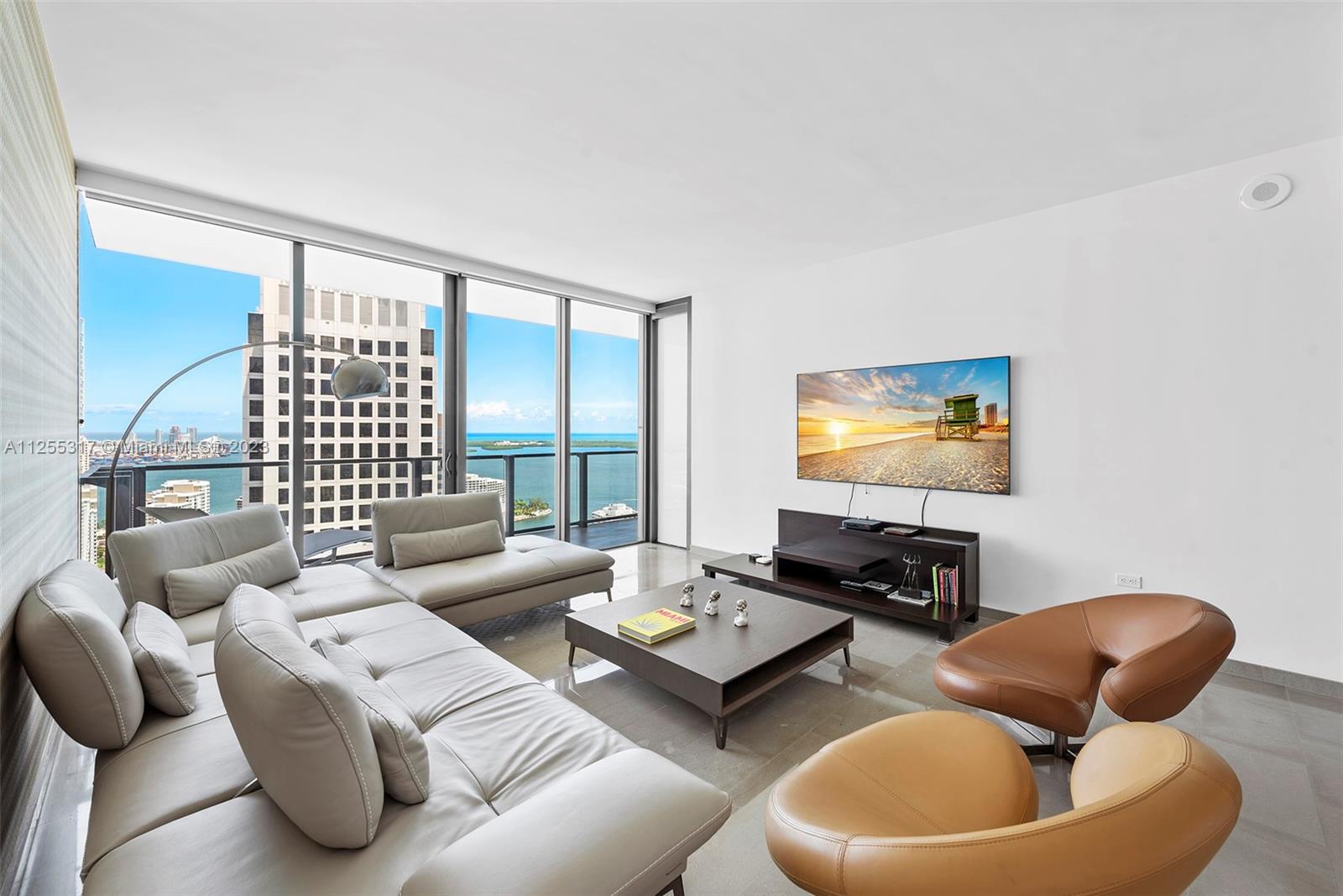 Experience Brickell living at its best with spectacular Bay and City views from this 3 bed + Den, 3.5 baths split floor plan in the most desired 03 line at Brickell City Center's Reach Condo Tower.  You will enjoy private access to the BCC shopping, dining and entertaining gallery.  This bright and spacious unit features over 50 linear feet of balcony accessible from every bedroom and the living area, floor to ceiling windows and doors, marble floors, Italkraft cabinets, quartz countertops and premium Bosch appliances.  Half-acre amenity deck includes tropical gardens, BBQ grills, indoor and outdoor gym, heated lap and social pool, pool side cafe, Spa with Sauna, steam room and dipping pool, children's playroom, Business center, library and more.  Full time concierge on Level 6.