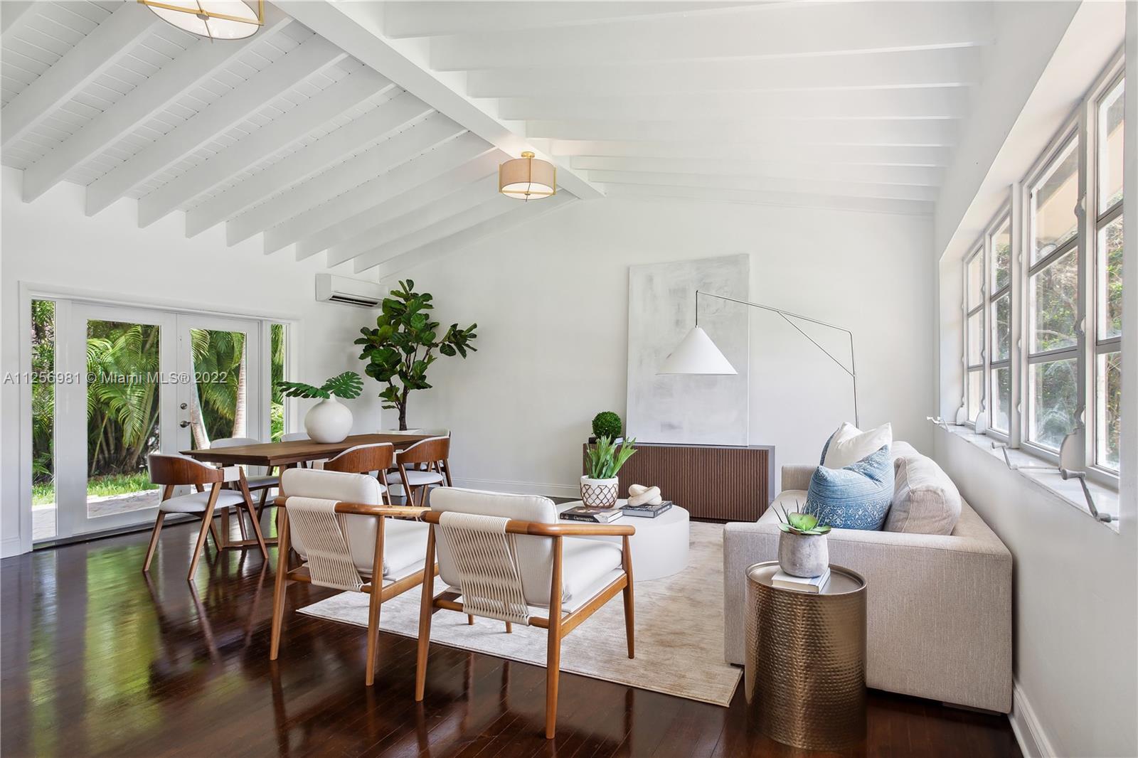 Charming mid Century Florida style home.  Situated in the sought after French Village area this corner bright residence with gleaming wood floors, exposed white beamed ceilings in the grand room and surrounded by nature offers a romance between charm and functionability.