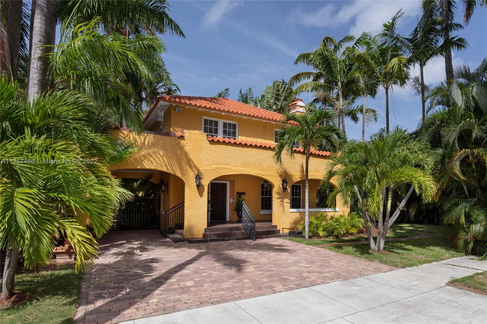 Designed by one of the architects of famed Vizcaya with impeccable woodwork, high ceilings, and large entertaining spaces, this historic estate on a waterfront street in Coconut Grove wows with character, charm, and warmth. Updated kitchen. Hardwood floors throughout. Serene, lush tropical courtyard and grounds. Two-story guest house with one bedroom apartment including full kitchen and separate laundry/storage. Ample parking for 5+ cars. Just steps from the bay and walking distance to parks, yacht clubs, and a top private school. Short drive to all the great restaurants, shopping and entertainment in Coconut Grove’s village center, Brickell/Downtown, and Coral Gables. **Some photos virtually staged/renovated. Please see unedited photos at the end of the series.