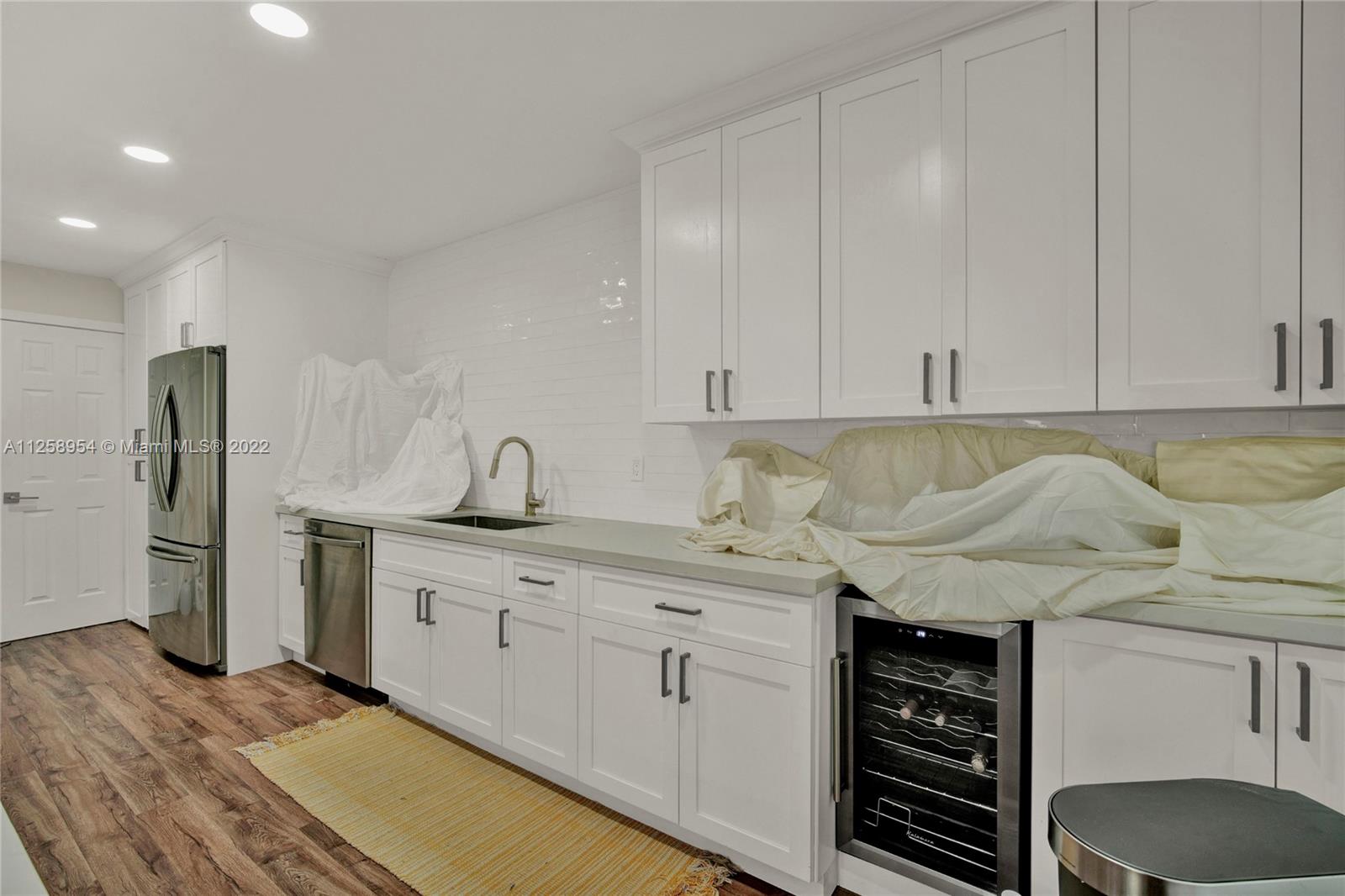 Dreamy completely remodeled in 2020 featuring 2 bedrooms with 1 bathroom upstairs and a half bathroom downstairs for guests. Kitchen offers stainless steel appliances (refrigerator, stove/oven, microwave, dishwasher, and temperature controlled wine storage), with bright white shaker cabinets and glossy white subway tile. Bathroom upstairs has bathtub with herringbone pattern tile installation for an upscale look. Property has impact windows and doors, a walled off private patio, and volume ceilings and lots of light in the bedrooms. You do not want to miss this property! Tenant occupied, DO NOT disturb tenant without a confirmed appointment.