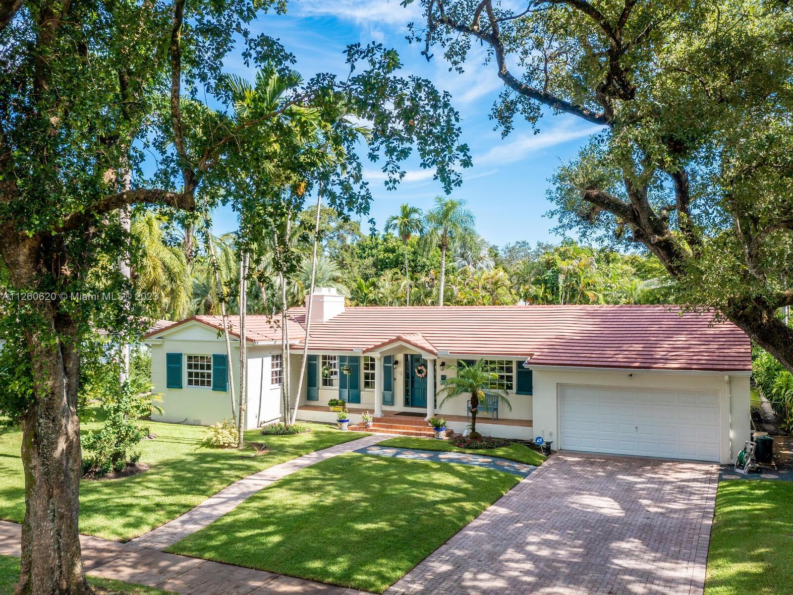 Lovely Spanish style home in the Country Club Coral Gables area. As per last Area Calculation Living Area 2,333.22 SF (under a/c). This 13,900 sq. ft. lot offers an opportunity to expand in the future, 3 bd, 3 br in the main house, and 1 bd/1 br in-law quarters with view of the swimming pool and garden. Hardwood floors throughout, working fireplace, updated granite stainless steel kitchen with formal dining room. 7 years old roof. Impact windows, oversized 2 car garage, a beautiful screened-in pool. This is turnkey with plenty of room for expansion. This house is just 5 minutes away from Downtown Coral Gables, and shops at Merrick Park. Close to Biltmore Hotel.