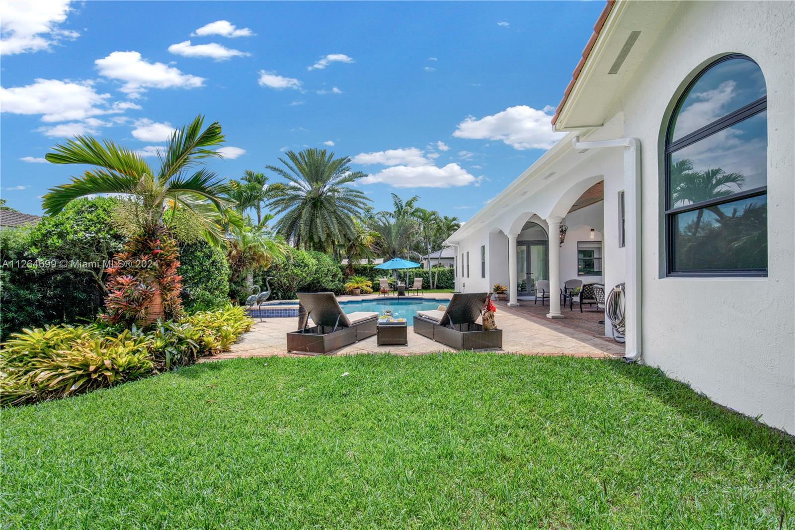 Covered Lounge Area & Stunningly Lush and Resort-Style Patio