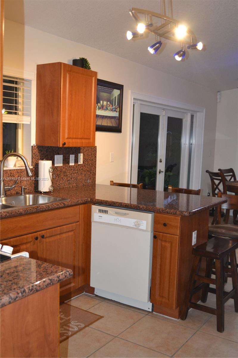 Remodeled kitchen with granite counter tops.