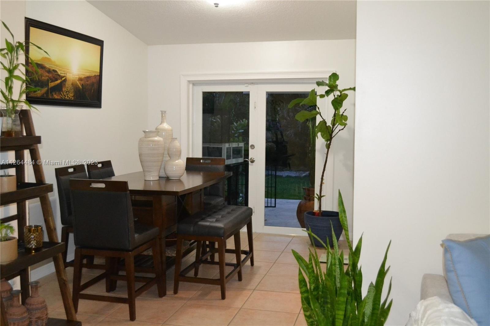 Formal dining room with impact double door.