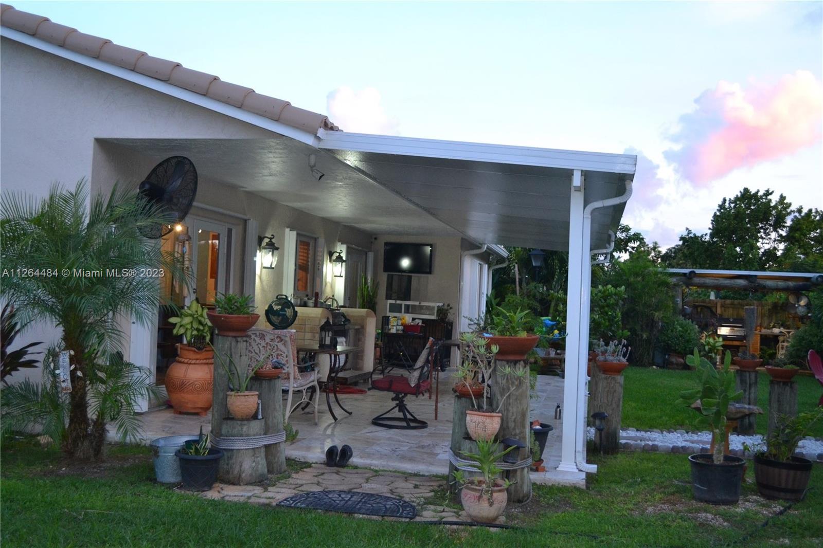 Beautiful back porch with travertine floors.