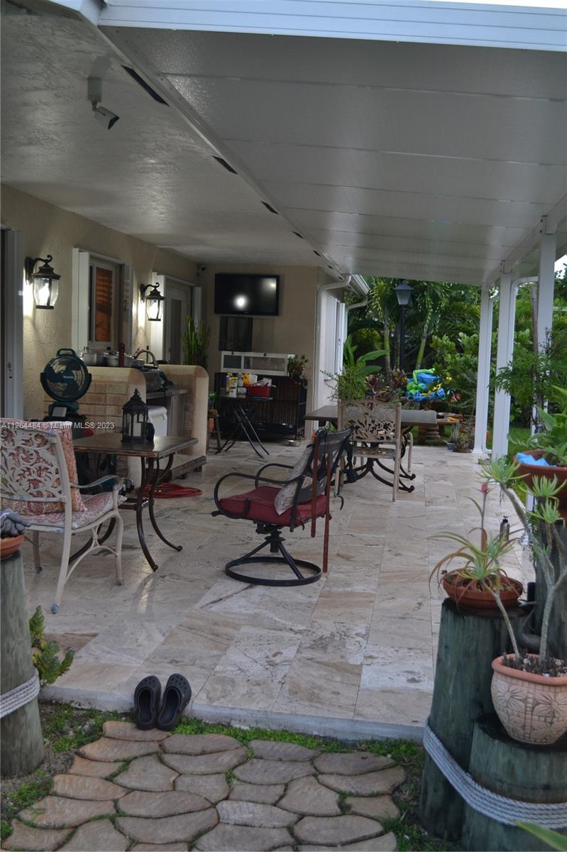 Beautiful back porch with travertine flooring.