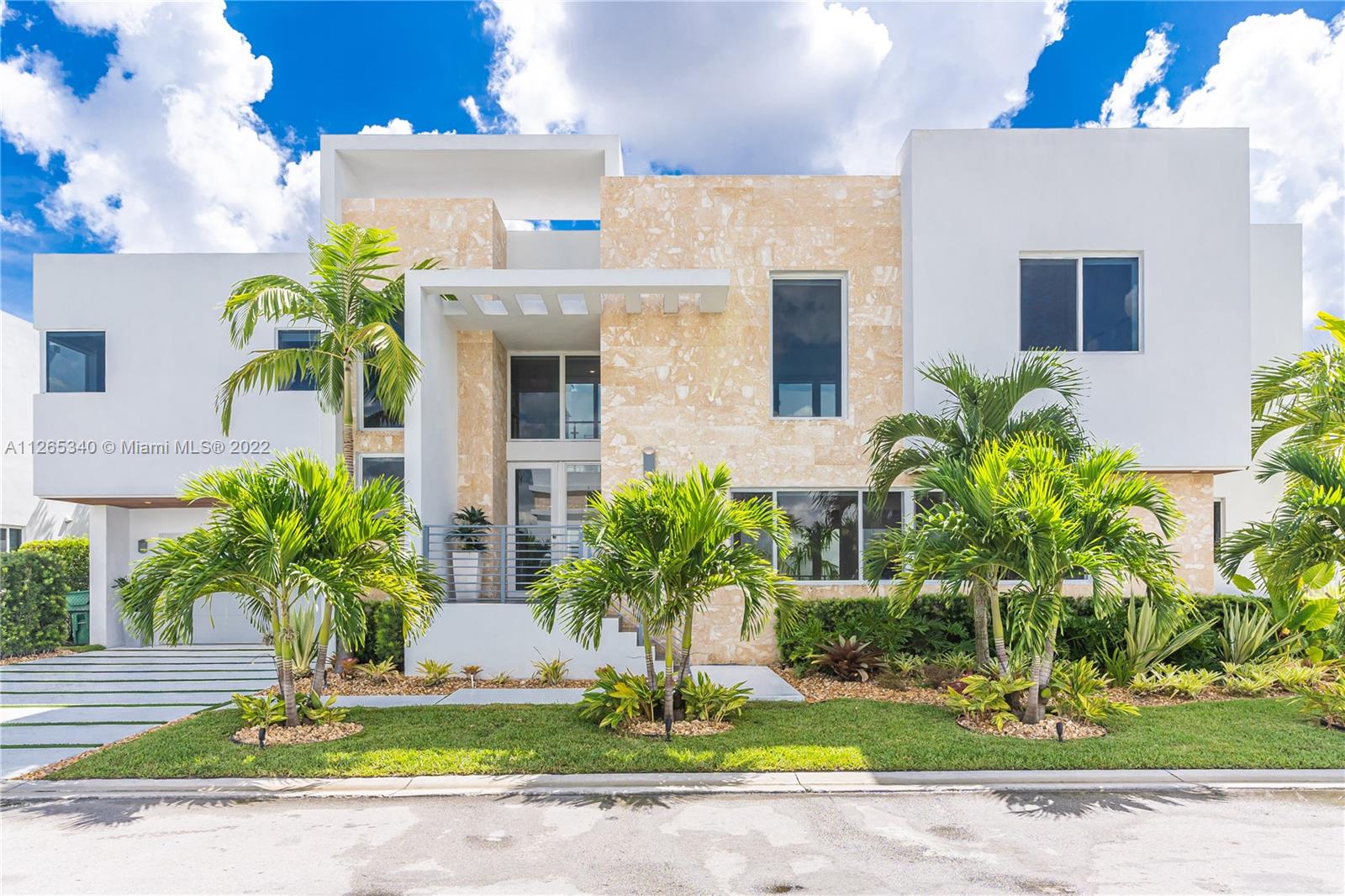 Modern & totally remodeled home in Doral. Fully furnished by Artefacto! 2018 Built. Corner house-2 story, 4BR/5 Full BA. Ultra-modern wine cellar display, Saltwater-Heated Pool w/water and lighting features, new cement driveway, tropical landscape, & more. Sophisticated finishes: double-height ceilings in living area, glass railings staircases, 2nd floor terrace w/sitting area w/pool view. Beautiful Kitchen w/BOSCH appliances, European cabinetry & quartz counters. 100% smart home by Phone (able to control: A/C, garage door, shades, TVs, Pool water & light features, landscape Lighting, indoor/outdoor accent lighting throughout, Terrace lighting, Wine cellar lighting, Etc.). Impact windows/doors. Guard-gated 24/hrs security. Clubhouse w/gym, party room, pool, jacuzzi, sauna, & billiard.