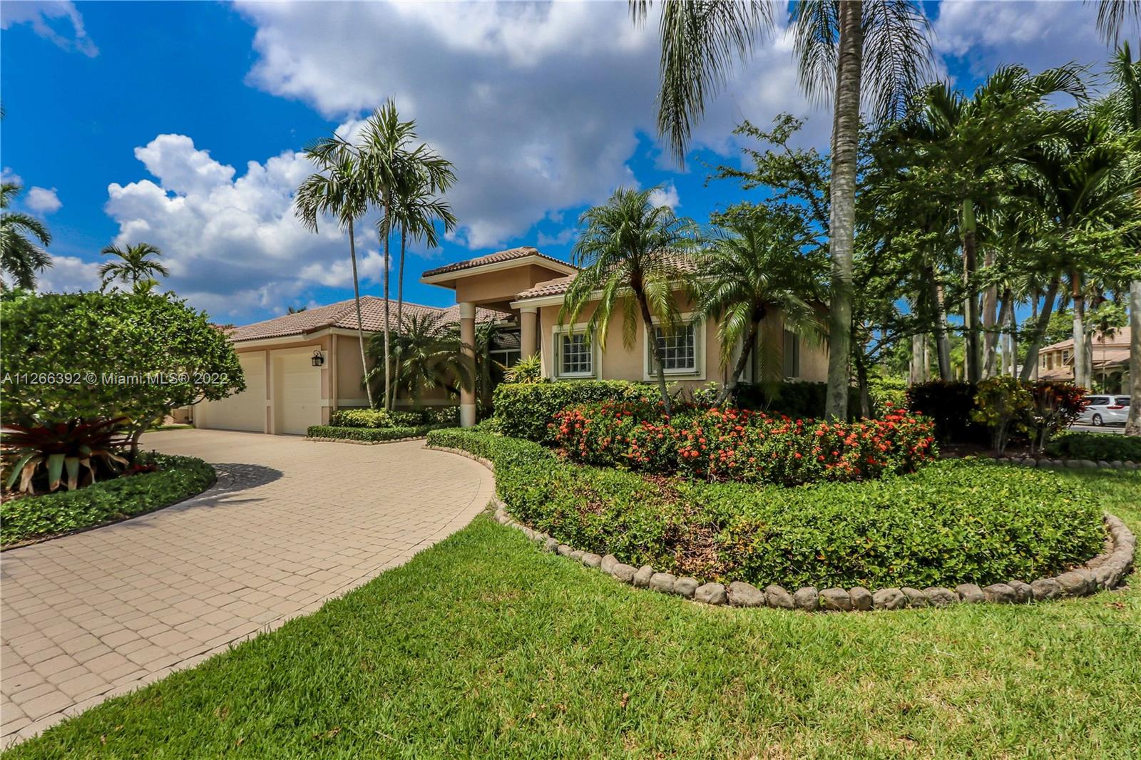 Welcome to your dream house in the beautiful Weston Hills Country Club. This is a one story, 4 bedrooms, 3.5 bath, plus den with window and closet ideal for a home office. Spacious 3-car garage and circular driveway. Upon entering, gorgeous pool views set the tone for an inviting and classic South Florida living area. The home is walking distance to plenty of open space and a beautifully maintained neighborhood park - perfect for social, wellness, and recreation activities. The home is meticulously maintained with high-end custom design touches, including high ceilings, custom closets, luxurious finishes, and more. The property is excellently located near top-rated A-rated schools, shopping, restaurants, major highways, a twenty minutes drive to Florida’s famous beaches, and more!