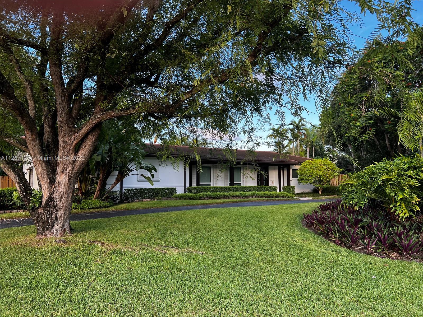 This amazing 0.52- acre corner house is located in one of the best and most serene neighborhoods in Pinecrest on the water. Surrounded by lush tropical and native plants, is a one-story home with an abundance of natural light with much to offer. New roof, Impact windows and doors all house, new A/C unit. All bedrooms with upgraded wood laminate flooring upgrade, new master bathroom with a walk-in shower and double shower. surveillance cameras, outdoor kitchen, two outdoor gazebos and more. Resurfaced and tiled pool, beach area with mature coconut palms, comfy swing and deep fire pit, sprinkler system. Dock for fishing or canoe/kayak loading. Come and enjoy the lifestyle that Pinecrest has to offer with A+ rated Palmetto schools, close to all major thoroughfares, parks, and shopping.