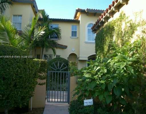 PRIVATE MEDITERRANEAN STYLE RESIDENCE IS ONE OF ONLY FOUR TOWNHOUSES KNOWN AS "PONCE VILLAS". LOCATED WITHIN WALKING DISTANCE TO UNIVERSITY OF MIAMI CAMPUS,A FIVE MINUTE DRIVE TO MERRICK PARK, RIVIERA COUNTRY CLUB, MIRACLE MILE AND SHOPS AND RESTAURANTS ON SUNSET DRIVE. BUILT IN 2001, FEATURES INCLUDE 2 STORY VAULTED CEILINGS IN LIVING ROOM, EAT-IN KITCHEN WITH GRANITE COUNTERTOPS AND STAINLESS STEEL APPLIANCES, GRACIOUS MAIN SUITE WITH 2 WALK  IN CLOSETS, SEPARATE TOILET ROOM, DOUBLE SINKS, TUB AND SEPARATE SHOWER AND FRENCH DOORS OPENING TO THE TERRACE. MARBLE FLOORS ON 1ST FLOOR AND GLEAMING HARDWOOD ON 2ND FLOOR. A RESTORED HISTORICAL 1927 PAVILION/ FULLY EQUIPPED EXCERCISE ROOM FOR USE BY RESIDENTS AND ENHANCES THE SECURE WALLED IN, LANDSCAPED GARDEN ENTRANCE.