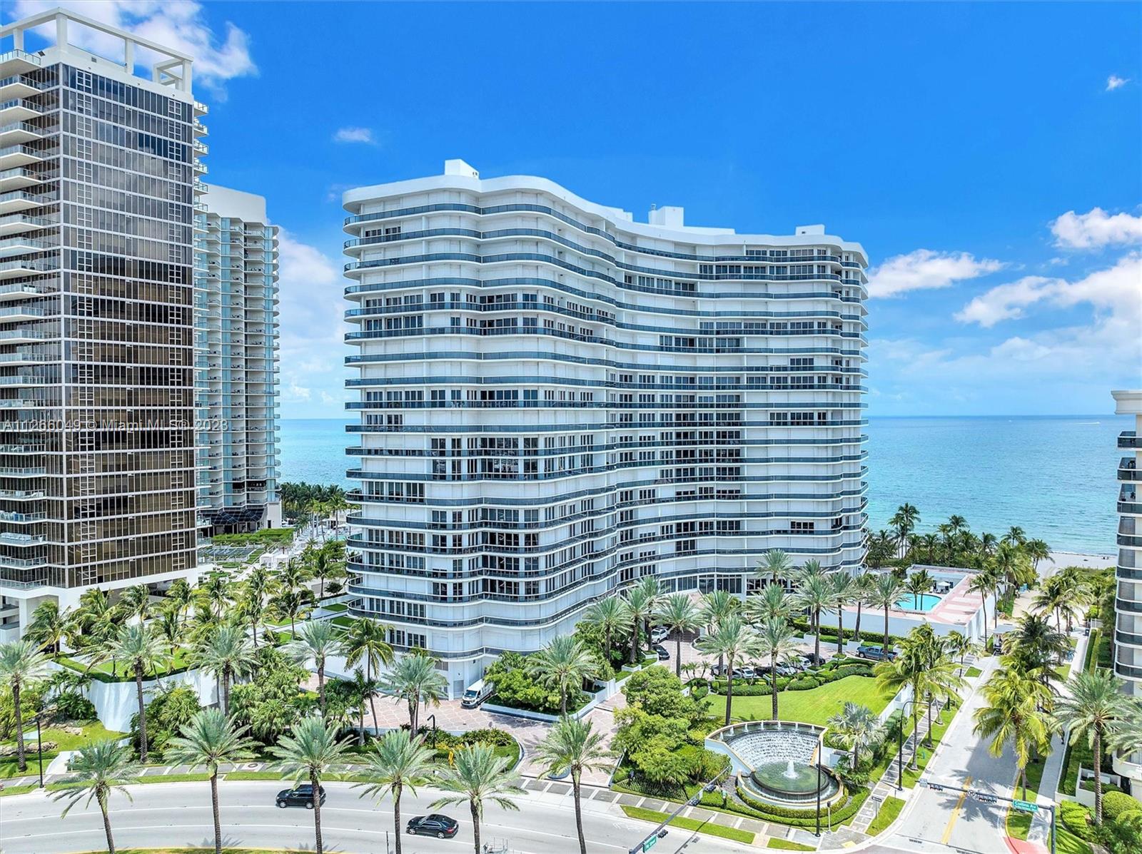 WOW! Private elevator opens to breathtaking 180 degree views from floor to ceiling hurricane  windows and wrap around balcony Ultra luxury oceanfront building located in village of Bal Harbor.Across from the exclusive Bal Harbor shops with fine dining and designer shops. Walk to awe-Inspiring houses of worship. Heart-stopping excruciating attention to detail in this expansive 3 bed+den 3.5 bath masterpiece with imported designer features & unique finishes. Feast your eyes on the spectacular open kitchen with marble counters and new Viking appliances. Plus new porcelain floors, standing tub in the spacious master bathroom,custom built closet, motorized shades & hi-tech washer dryer. Highly amenitized complex with full service concierge, valet, security, gym/spa, restaurant & tennis club++--