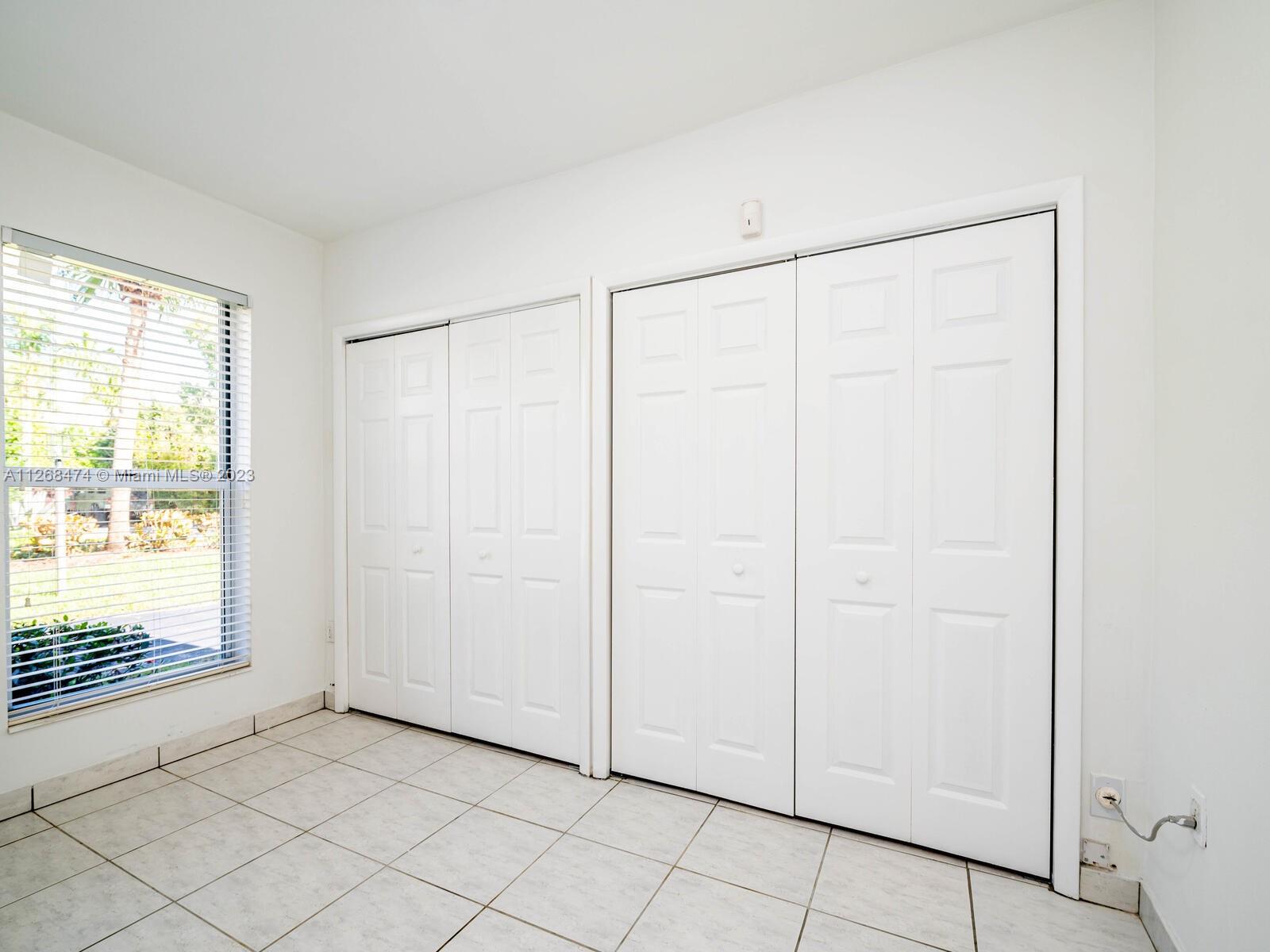 Bedroom adjacent to side entry room