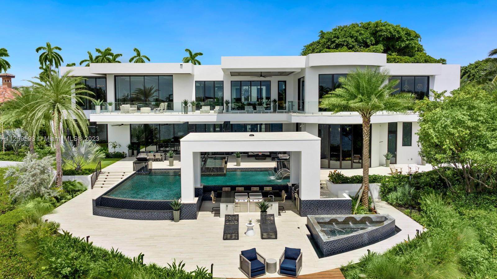 Step Inside With Me! The Mansion of Manalapan defines ultra modern architecture within the comforts of a real home. 110 Churchill by the Numbers: 9 baths, 8 beds, 7 terraces, 6 bars, 5 garages, 4 lounges, 3 kitchens, 2 primary suite closets, & 1 Theatre, Office, Cigar lounge, & Gym. Meticulously designed by a budget-less owner, specialty features include 26 FT ceilings, wine room, & multiple fireplaces. The culinary experience is complete with show+prep+glass kitchens. The primary suite exemplifies opulence with dual walk-in closets & baths, midnight bar, glass sitting area and an oversized terrace. The entertainer’s stage is set outdoors overlooking the calm waters with sparkling pool, spa, & grand gazebo for hosting. Churchill Way: an address that represents elegance, history, & privacy.