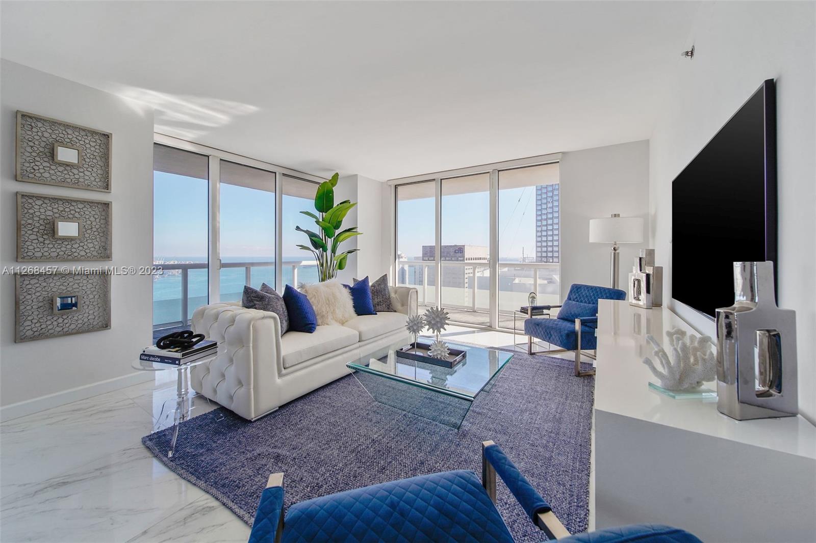 Enjoy spectacular views of Biscayne Bay, Port of Miami, and Miami Beach from this 3 bed/2 bath corner residence located in the heart of Miami. This Southeast corner unit features an open kitchen/living room layout, porcelain floors throughout, ample closet space, washer and dryer, tiled balcony and views from each room. 50 Biscayne is a full amenity building with an Olympic-size heated pool, state of the art spa, private fitness center, tennis, security valet parking and concierge service. Enjoy living across bay front park with the convenience of being minutes away from Miami’s top museums, restaurants, nightlife, financial district, best hospitals, public transit hubs and main highways.