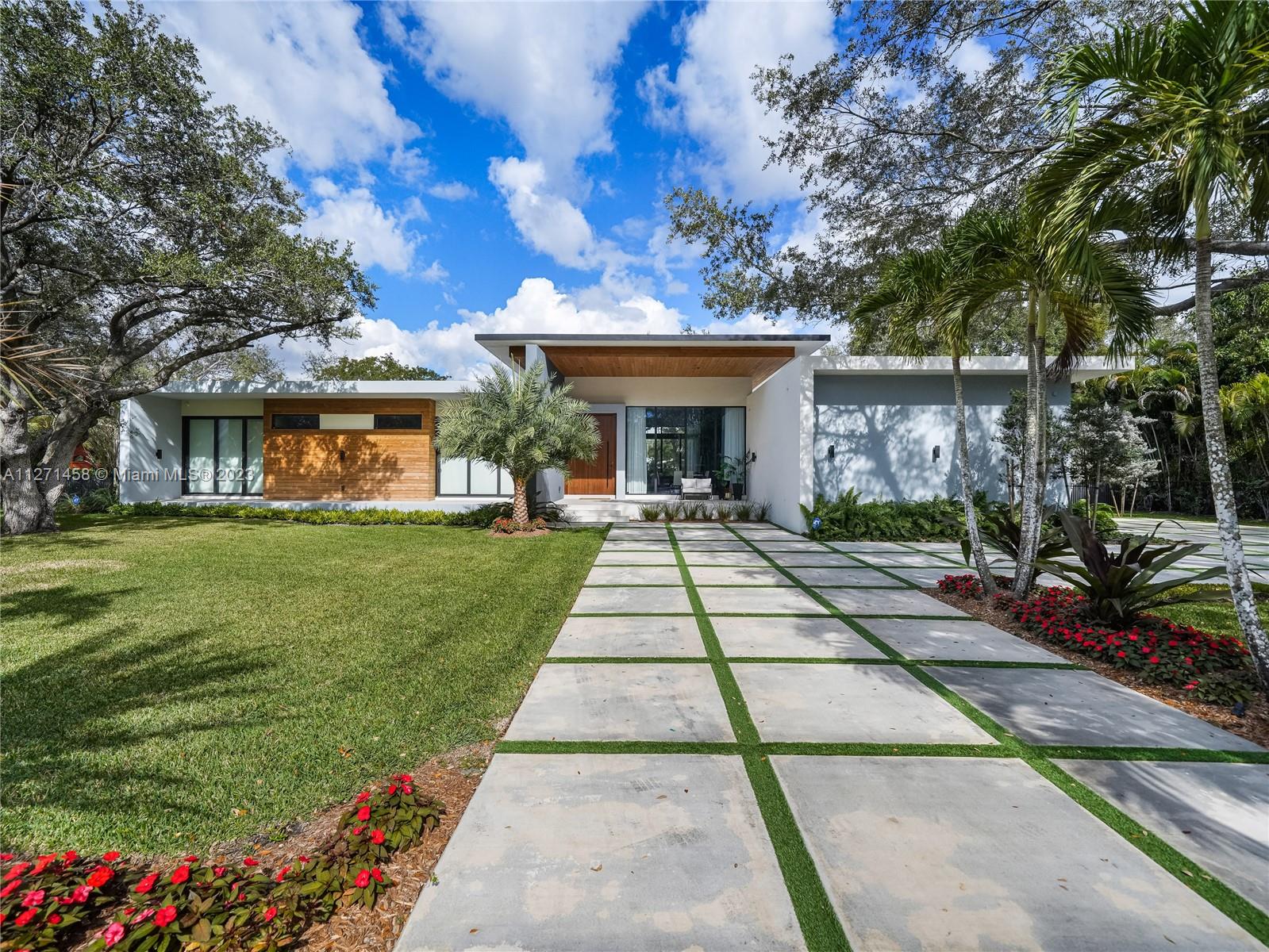 Beautiful Modern Construction in the Heart of Pinecrest. This spectacular home includes: 5 bedrooms, 5.5 bathrooms in the main house with a 1/1/ guest house, fully gated and sits on a 38,766 sqft lot. The main entrance greets you with an 11ft hurricane proof Mahogany pivot door and the throughout the home you have high ceilings ranging from 10 to 14 ft. Fully equipped with Italkraft kitchen cabinets, quartz counters and Miele, Wolf and Liebherr appliances. All bedrooms are fully ensuite and  are completed with Mia Cucina closets.