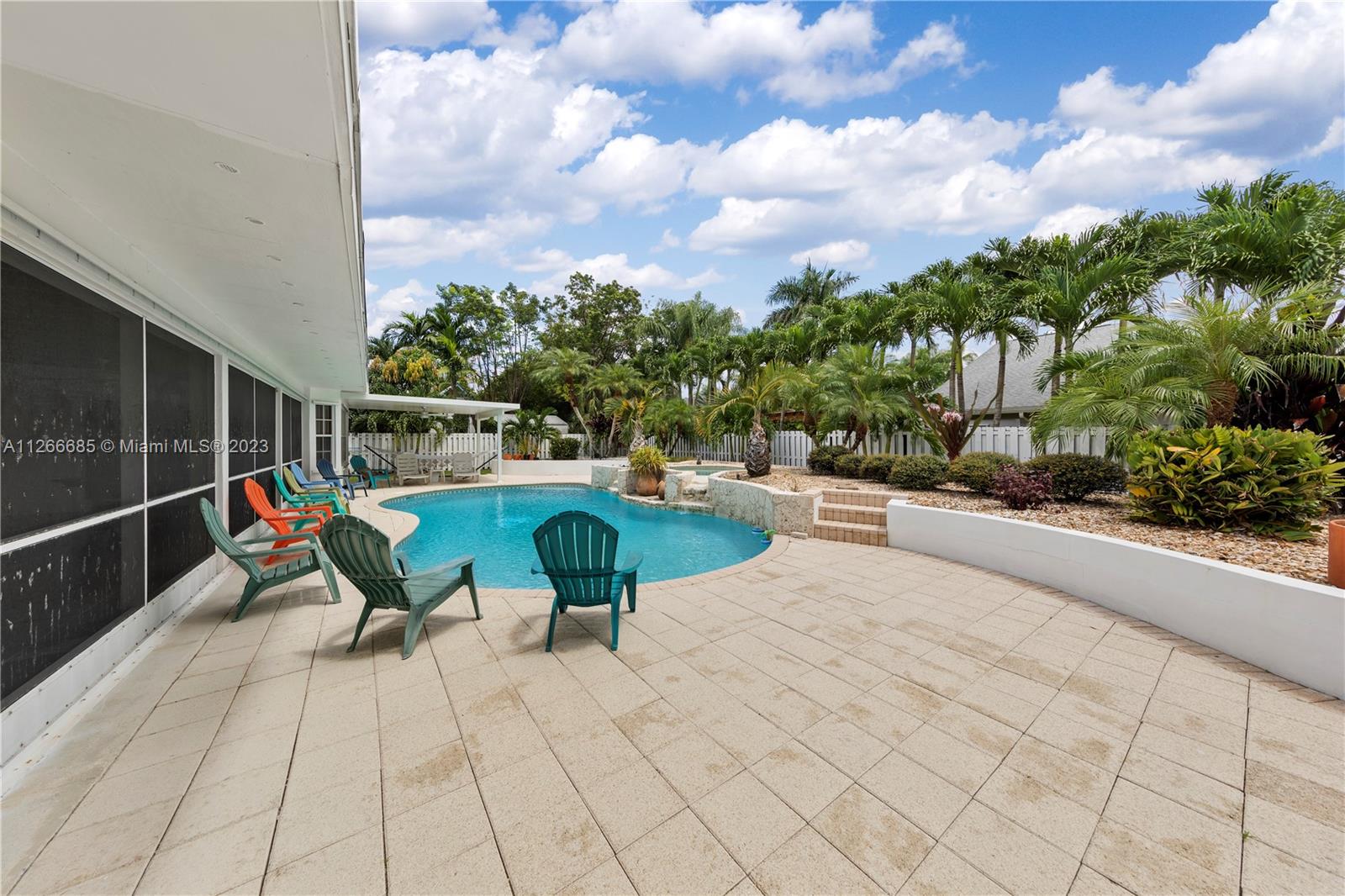 PAVERED POOL DECK & LUSH LANDSCAPING... THIS IS A LARGE SPACE...