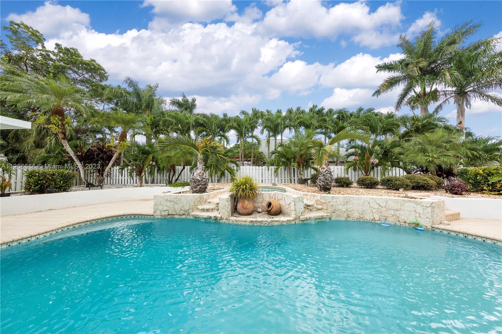 RESORT LEVEL POOL ... RAISED KEYSTONED LINED SPA (HEATED) WITH WATERFALLS RUNNING INTO THE POOL