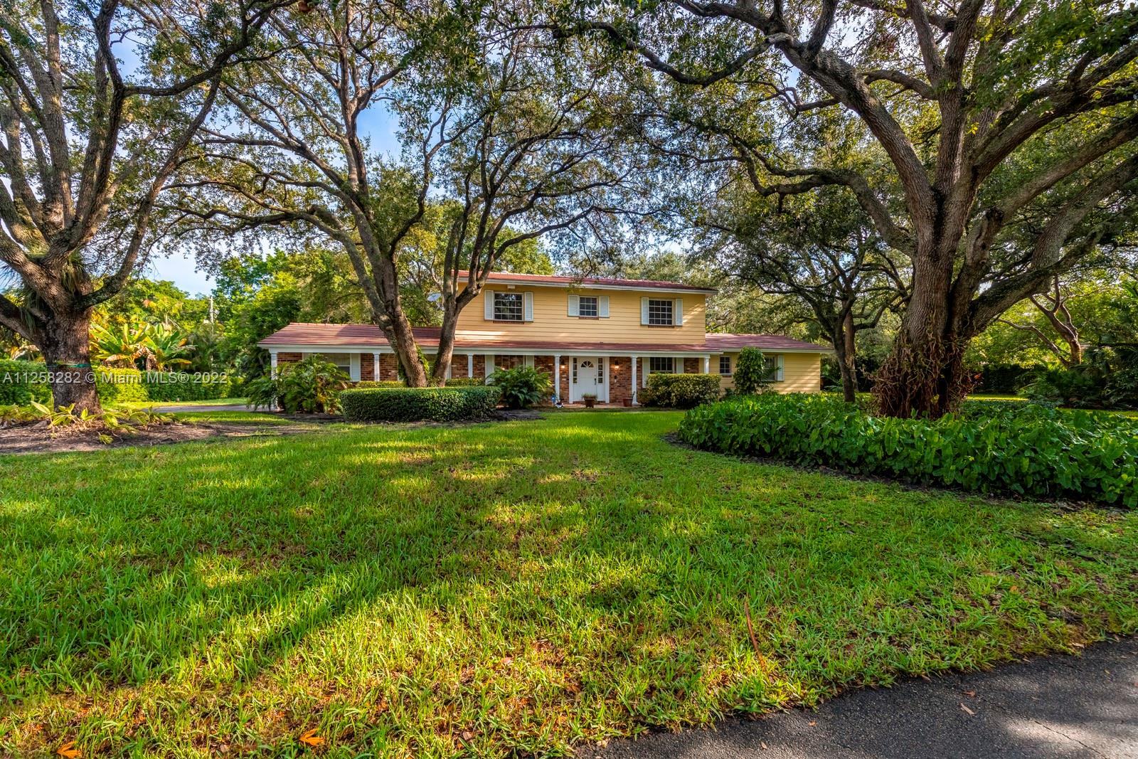 A ranch home that presents the perfect balance between traditional and classic. Welcome to this beautiful 6 bed, 4 full bath, and 1 half bath home, spanning 3,598 sq. ft of living space, located in the heart of Pinecrest. Immediately upon entering the home, residents will find a wrap-around porch that’s encapsulated with character and is under the cover of beautiful oak trees. The interior features a large open floor plan, featuring a spacious living room, dining room, and gourmet kitchen detailed with luxury accouterments. Here, residents will find the ideal destination to entertain with an abundance of natural sunlight filling the room from every angle. One of the highlights of the residence is the covered pool deck that makes hosting family and friends inviting and easy.
