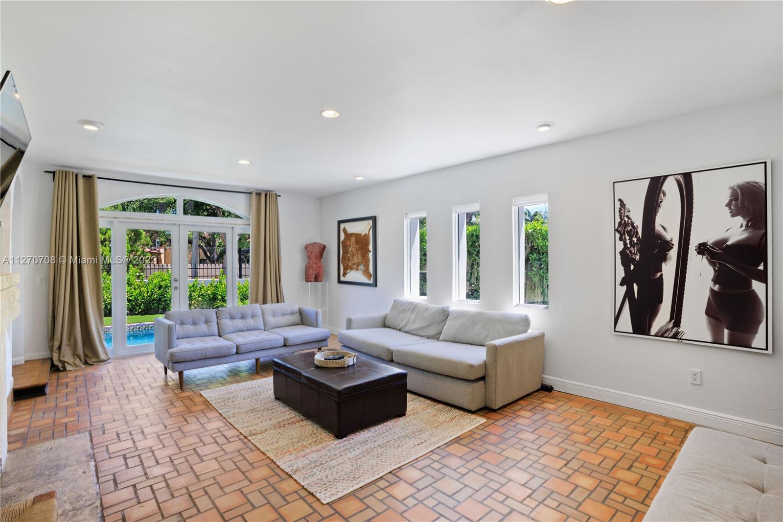 Large Living room light and bright overlooking the garden and pool.