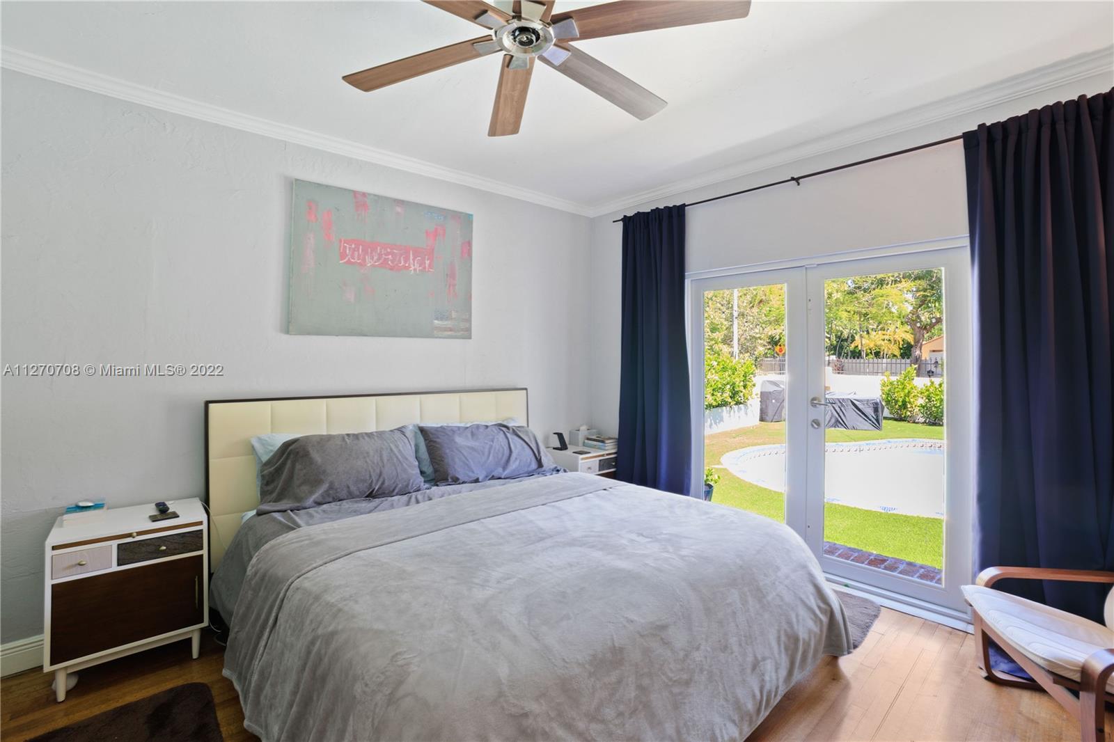 Master Bedroom with views of the pool area.