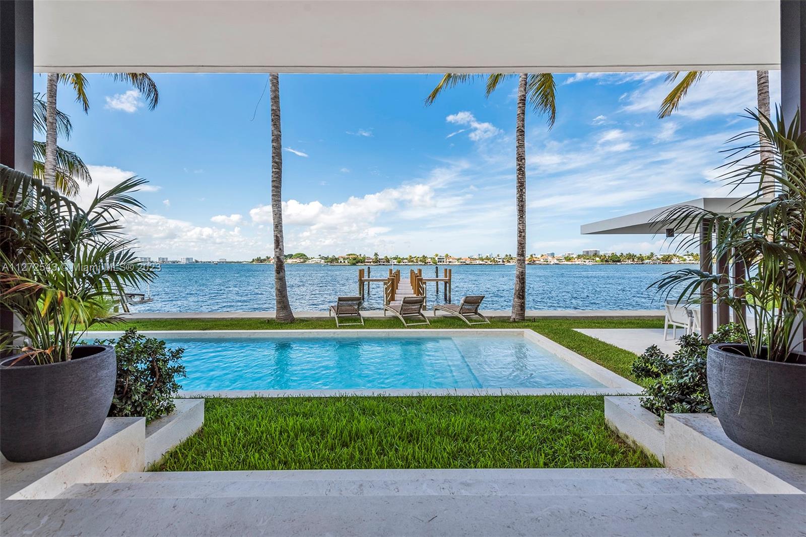 Overlooking Biscayne Bay and the billionaires of Indian Creek Island, this brand new, never lived in mansion, features 6 bedrooms and 7.5 baths over 5625 sqft under air with 75ft on the water and 2 car garage. With its Mid-Century Modern flair and an attention to details rarely seen, this home will leave you speechless. Gated community and walking distance to the beach. Built by Luxury Builder Puren Homes.