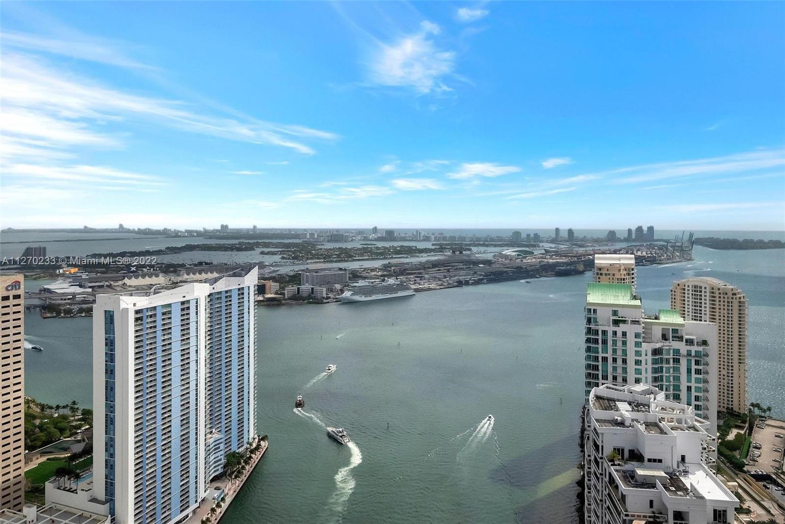 Welcome to your new home in the sky. This rarely available corner unit on the 56th floor is also one of the few units with 2 deeded parking spaces! Open the door to this unique lower penthouse and you’ll be greeted with breathtaking bay and river views. Well-maintained and freshly painted, it’s move-in ready. Once you arrive, you won’t want to leave. Icon Brickell is a dog-friendly condo surrounded by lush green parks with walking paths on either side. Enjoy resort-style amenities including a 300 ft long swimming pool, thermal hot tub and wading pool overlooking Biscayne Bay, full-service spa & fitness center, movie theater, game room, Icon Café with poolside food & beverage service and poolside towel service, 24-hour full-service concierge, acclaimed restaurants on-site and much more.